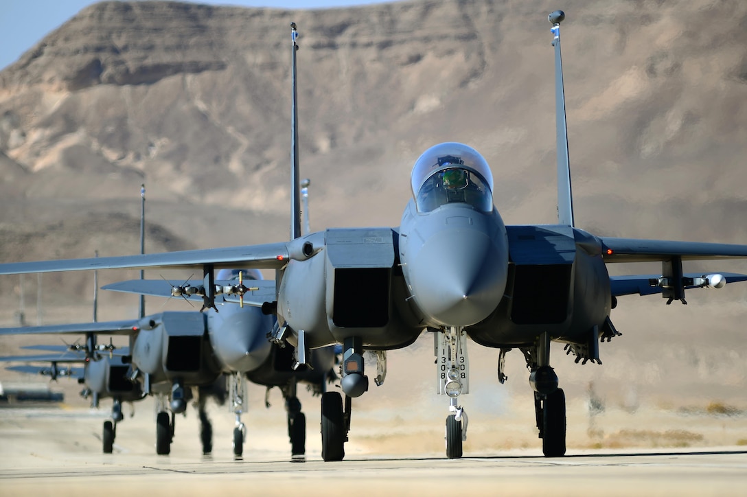 A group of F-15E Strike Eagles taxi following a combat mission during Blue Flag exercise Nov. 26, 2013, on Uvda Air Force Base, Israel. Aircraft from the 492nd Fighter Squadron, Royal Air Force Lakenheath, England, deployed to participate in the exercise, where they engaged multiple heavy air defense assets, ground base targets and simulated opposition forces to meet combined operations requirements. (U.S. Air Force photo/Master Sgt. Lee Osberry)