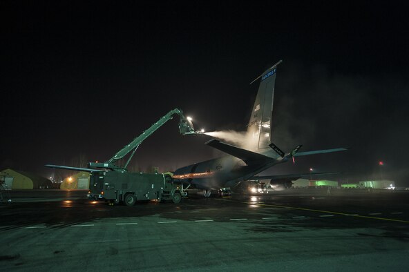 Airmen from the 376th Expeditionary Aircraft Maintenance Squadron de-ice a KC-135 Stratotanker Nov. 27, 2013, at the Transit Center at Manas, Kyrgyzstan. Using an extended reach de-icer, Airmen remove the build-up of snow, frost and ice from the aircraft to prevent obstruction of flight operations. The buildup of debris can affect the aerodynamics of an aircraft resulting in a potential emergency. The 376th EAMXS ensures all aircraft are de-iced and secure prior to take off. (U.S. Air Force photo/Staff Sgt. Krystie Martinez)