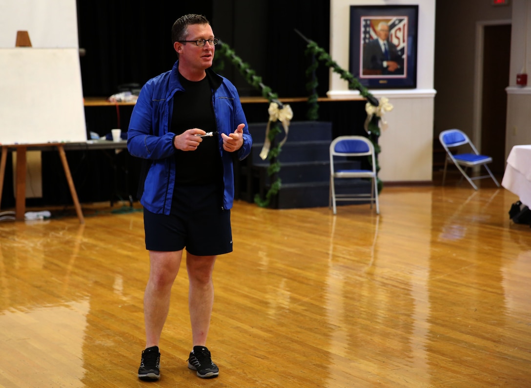 Army Sgt. 1st Class Russell Zink, a physical fitness and nutrition instructor with the 360 training team, instructs Marine sergeants and above within 2nd Marine Division about proper running technique to avoid injuries and maximize efficiency while exercising during a class at the USO in Jacksonville, N.C., Dec. 4, 2013. The week-long Marine 360 Leaders’ Course covered everything form proper physical fitness to dealing with stress after returning from a deployment to help develop leaders within the Marine Corps.