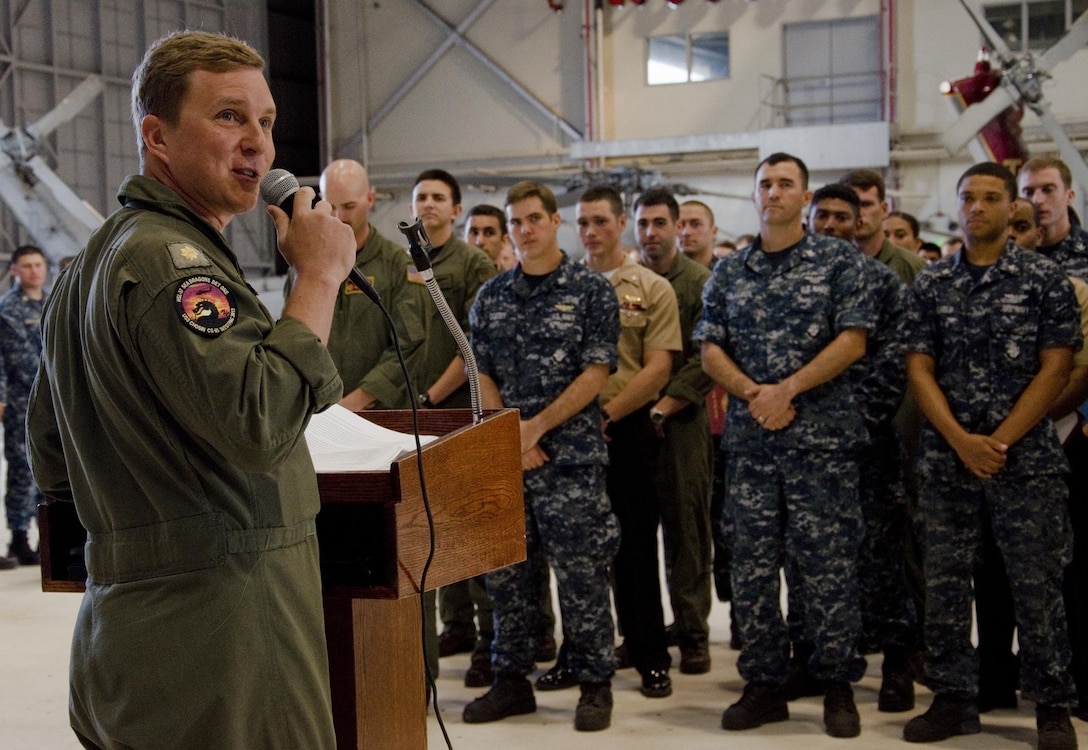 Lt. Cmdr. Mark Kurtz, the officer in charge of Detachment 1, Helicopter Maritime Strike Squadron 37 and native of Alexandria, Va., makes a few remarks during a homecoming and awards ceremony in Hangar 103, Nov. 27, 2013. More than 20 sailors recently returned to Marine Corps Base Hawaii after a seven-month deployment in support of Exercise Triton Centenary. Kurtz said the deployment enabled the sailors to “build maritime interoperability and foster relations” with more than 20 nations including Singapore, Japan and Korea. Detachment 2 is currently preparing to deploy next. During the ceremony, the squadron welcomed the returning detachment, promoted sailors and presented various awards including Sailor of the Quarter, Navy Achievement Medal and flag letters of commendation for safety. (U.S. Marine Corps photo by Kristen Wong)