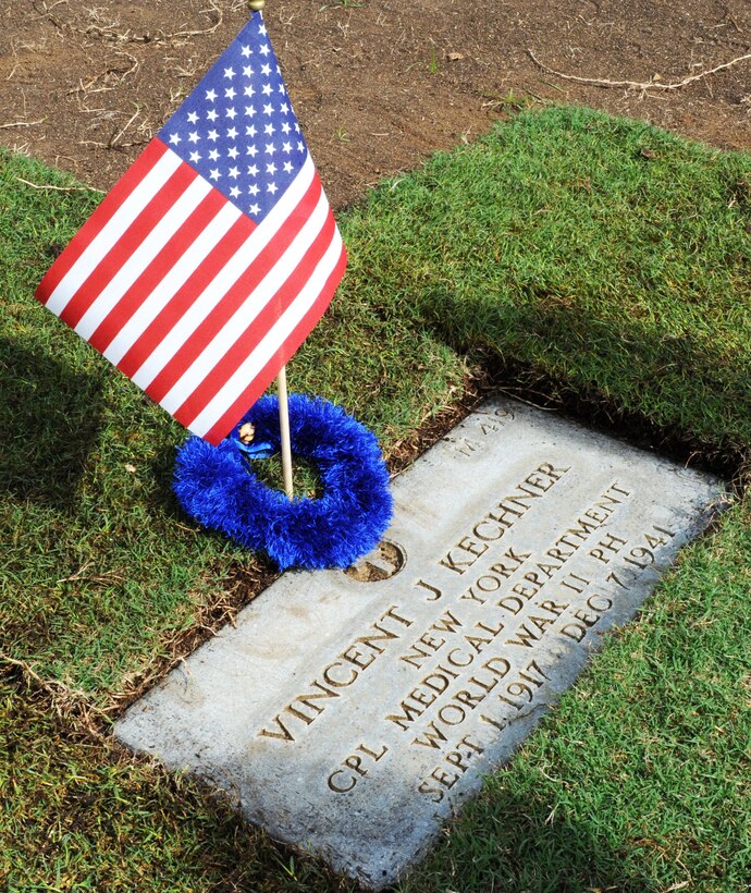 The gravestone of Cpl. Vincent J. Kechner, killed at Hickam Field during the Dec. 7th, 1941 attacks on Oahu military installations, Dec. 6, 2013, at the National Memorial Cemetery of the Pacific. Four representatives from the 15th Medical Group, including Col. Virginia Garner, 15th MDG commander, visited the cemetery to pay respects to Kechner, one of their medical field comrades. Kechner was scheduled to depart the island the day after the attacks. The 72nd Remembrance Ceremony commemorating the attack on Hickam Field is Dec. 7 and begins at 7:55 a.m. at the Hickam Field Flag Pole. (U.S. Air Force photo/Staff Sgt. Alex Martinez)