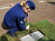 Staff Sgt. Ashley Dean, 15th Medical Group Bioenvironmental Engineering Flight, plants a U.S. flag at the gravestone of Cpl. Vincent J. Kechner, who was killed at Hickam Field during the Dec. 7th, 1941 attacks on Oahu military installations Dec. 6, 2013, at the National Memorial Cemetery of the Pacific. Dean and three other 15th MDG representatives, including Col. Virginia Garner, 15th MDG commander, visited the cemetery to pay respects to Kechner, one of their medical field comrades.
 
“It’s an honor and a privilege to come out and pay our respects to people who have lost their life trying to save others,” Garner said. “I feel it’s important to understand and honor our medical heroes.”
 
Kechner’s was scheduled to depart the island the day after the attacks. The 72nd Remembrance Ceremony commemorating the attack on Hickam Field is Dec. 7 and begins at 7:55 a.m. at the Hickam Field Flag Pole. (U.S. Air Force photo/Staff Sgt. Alex Martinez)
