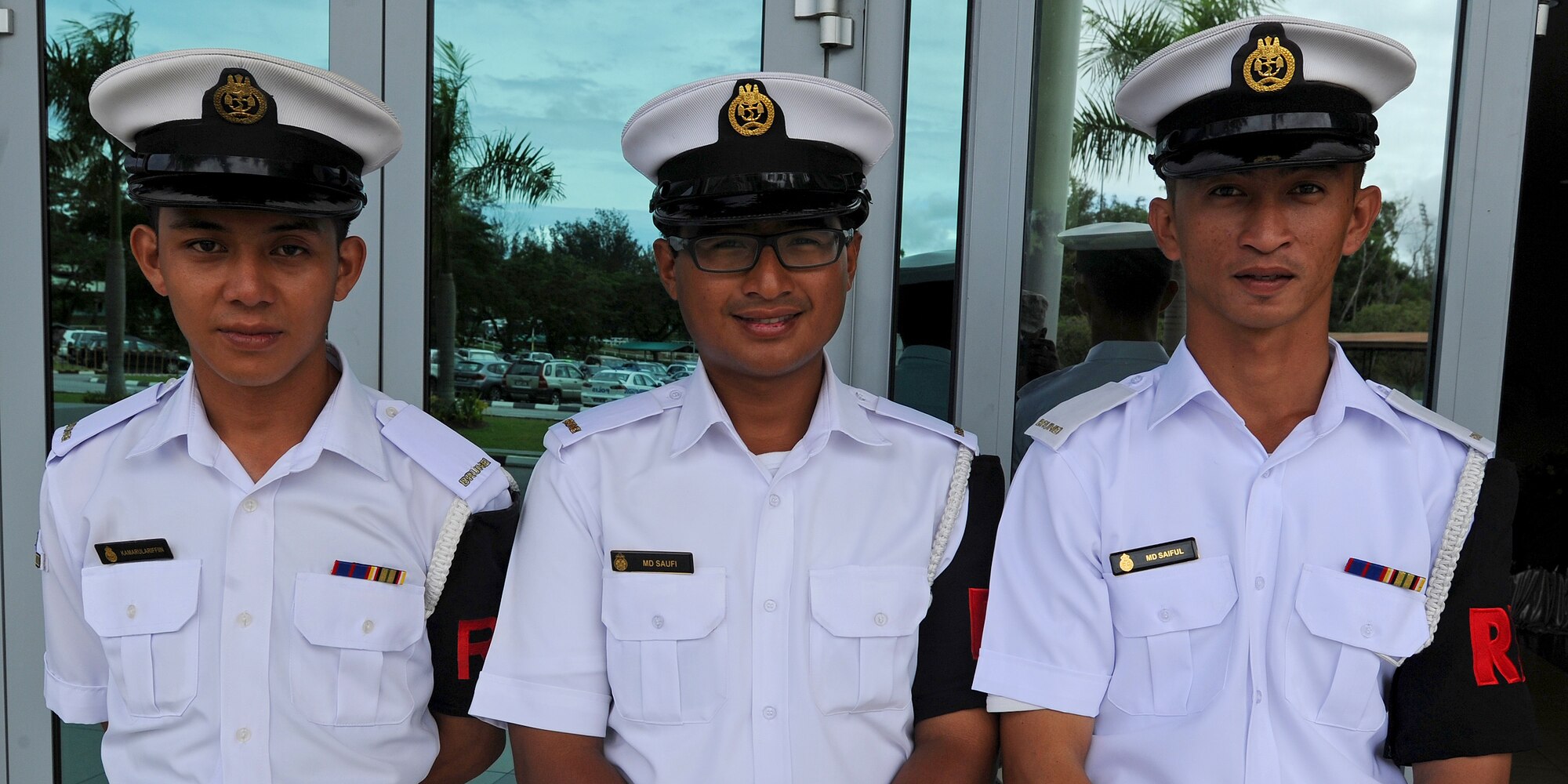 A group of Royal Brunei Navy seamen pose for a group photo during the fourth biennial Brunei Darussalam International Defense Exhibition at the BRIDEX Exhibition Center in Bandar Seri Begawan, Brunei, Dec. 5, 2013. BRIDEX 13 is an opportunity for networking and sharing technology with regional partners and allies which builds strong multilateral relationships, increases cooperation and enhances preparedness for disasters and other contingency operations. (U.S. Air Force photo/Master Sgt. Jerome S. Tayborn)