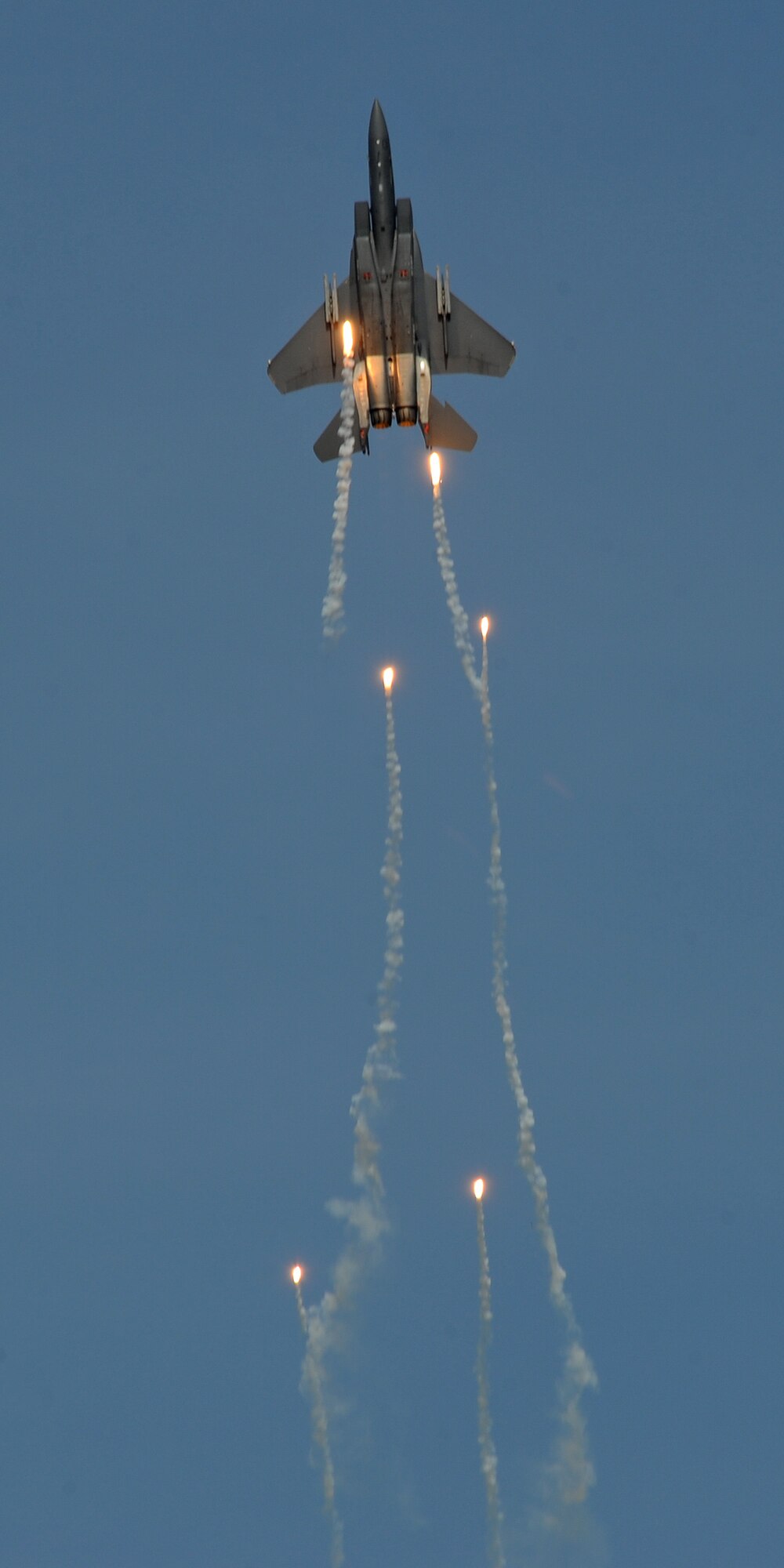 A Singapore Air Force F-15E Strike Eagle deploys flares during the fourth biennial Brunei Darussalam International Defense Exhibition at the BRIDEX Exhibition Center in Bandar Seri Begawan, Brunei, Dec. 5, 2013. BRIDEX 13 is an opportunity for networking and sharing technology with regional partners and allies which builds strong multilateral relationships, increases cooperation and enhances preparedness for disasters and other contingency operations. (U.S. Air Force photo/Master Sgt. Jerome S. Tayborn)
