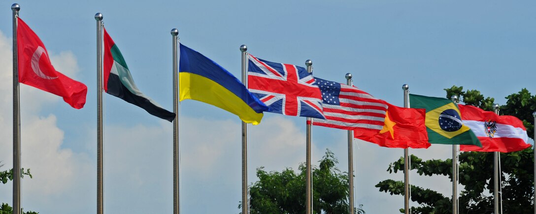 The United States flag flies amongst other participating nations' flags during the fourth biennial Brunei Darussalam International Defense Exhibition, at the BRIDEX Exhibition Center in Bandar Seri Begawan, Brunei, Dec. 5, 2013. BRIDEX 13 is a five-day event compromised of social events, displays and demonstrations. BRIDEX 13 is an opportunity for networking and sharing technology with regional partners and allies which builds strong multilateral relationships, increases cooperation and enhances preparedness for disasters and other contingency operations. (U.S. Air Force photo/Master Sgt. Jerome S. Tayborn)