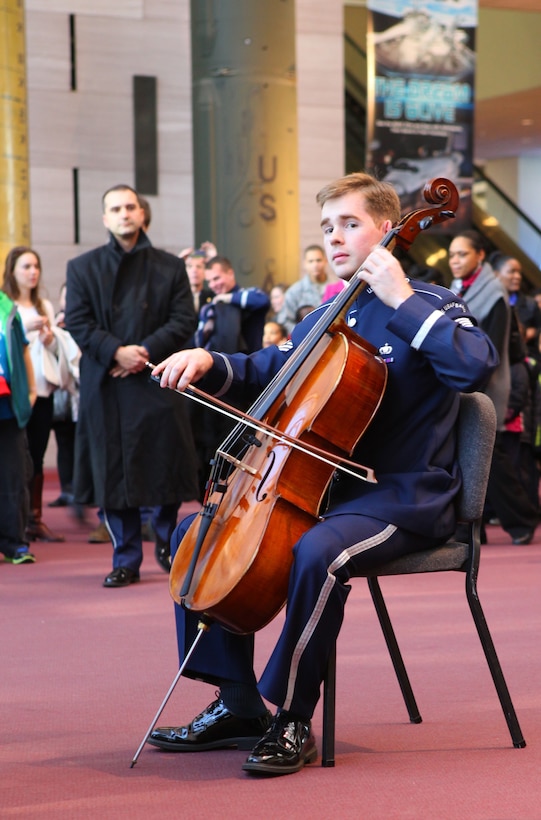 Cellist, Technical Sgt. Edward Prevost begins The U.S. Air Force Band's holiday flash mob at the National Air and Space Museum. (U.S. Air Force photo by Master Sgt Tara Islas/released)
