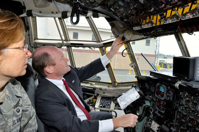 U.S. Air Force Brig. Gen. Carol Timmons, assistant adjutant general for air, Delaware National Guard, points out some of the differences between a C-130H and a C-130J aircraft to U.S. Sen. Chris Coons (D-Del.) during a tour of a Delaware Air National Guard C-130H on Dec. 2, 2013 at the New Castle ANG Base, Del. (U.S. Army National Guard photo by Staff Sgt. Wendy McDougall)