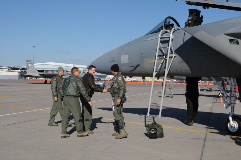 Current F-15C student pilots from the 144th Fighter Wing, Fresno, Calif., greet one of their fellow 144t members after he flew  into Kingsley Field, Klamath Falls, Ore. Dec. 4, 2013. The 173rd Fighter Wing is teaming up with the 144th to increase the number of students trained in order to meet an increased demand for F-15 pilots at the 144th. (U.S. Air National Guard photo by Master Sgt. Jennifer Shirar/released)