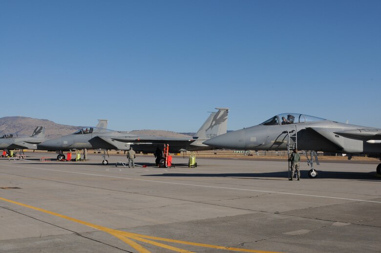 Four F-15Cs from the 144th Fighter Wing, Fresno, Calif., prepare to shutdown engines at Kingsley Field Dec. 4, 2013. The 173rd Fighter Wing is teaming up with the 144th to increase the number of students trained in order to meet an increased demand for F-15 pilots at the 144th. (U.S. Air National Guard photo by Master Sgt. Jennifer Shirar/released)