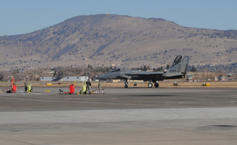 An F-15C from the 144th Fighter Wing, Fresno, Calif., taxis in at Kingsley Field Dec. 4, 2013. The 173rd Fighter Wing is teaming up with the 144th to increase the number of students trained in order to meet an increased demand for F-15 pilots at the 144th. (U.S. Air National Guard photo by Master Sgt. Jennifer Shirar/released)