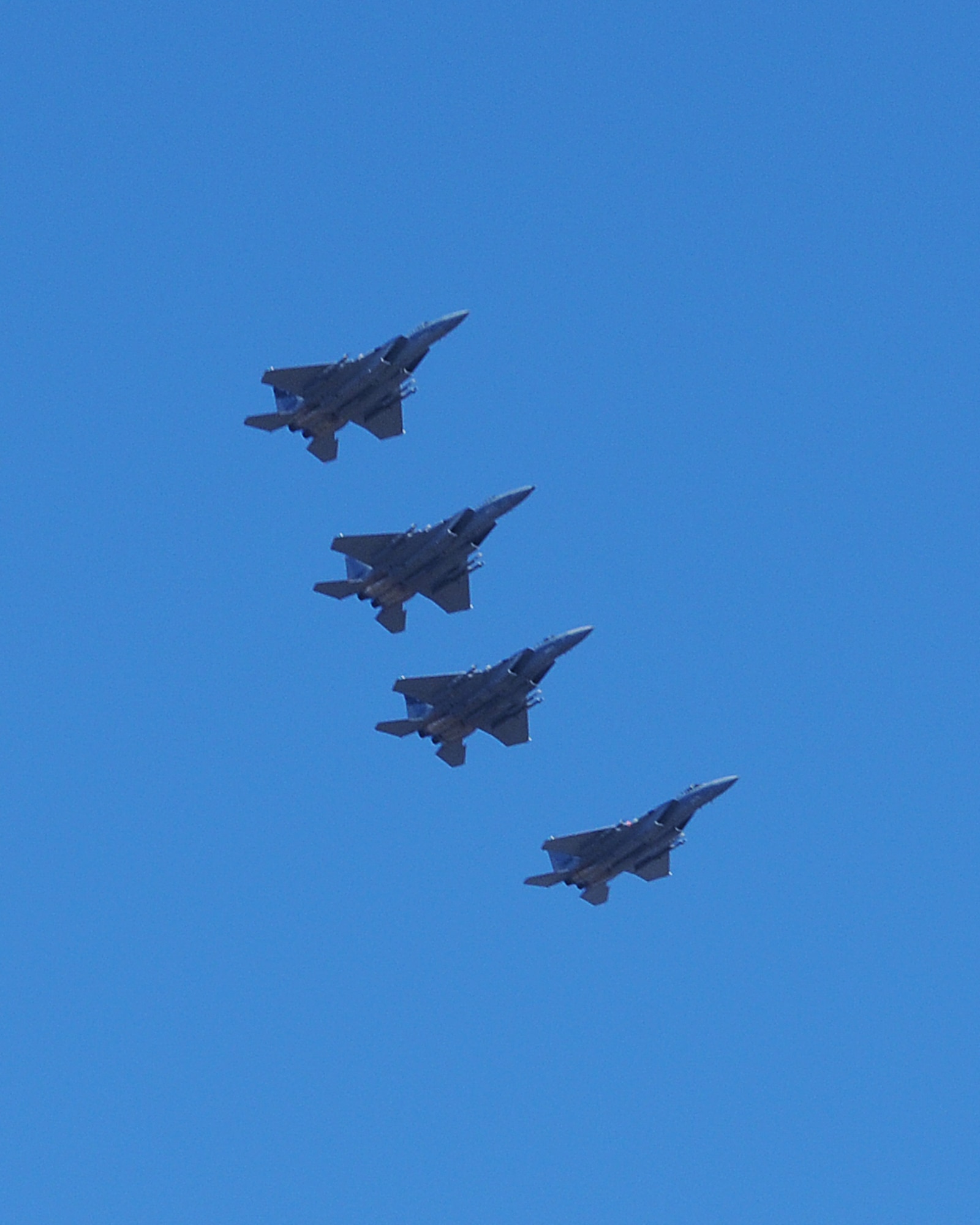 Four F-15Cs from the 144th Fighter Wing, Fresno, Calif., fly over the skies of Klamath Falls Dec. 4, 2013. The 173rd Fighter Wing is teaming up with the 144th to increase the number of students trained in order to meet an increased demand for F-15 pilots at the 144th. (U.S. Air National Guard photo by Master Sgt. Jennifer Shirar/released)