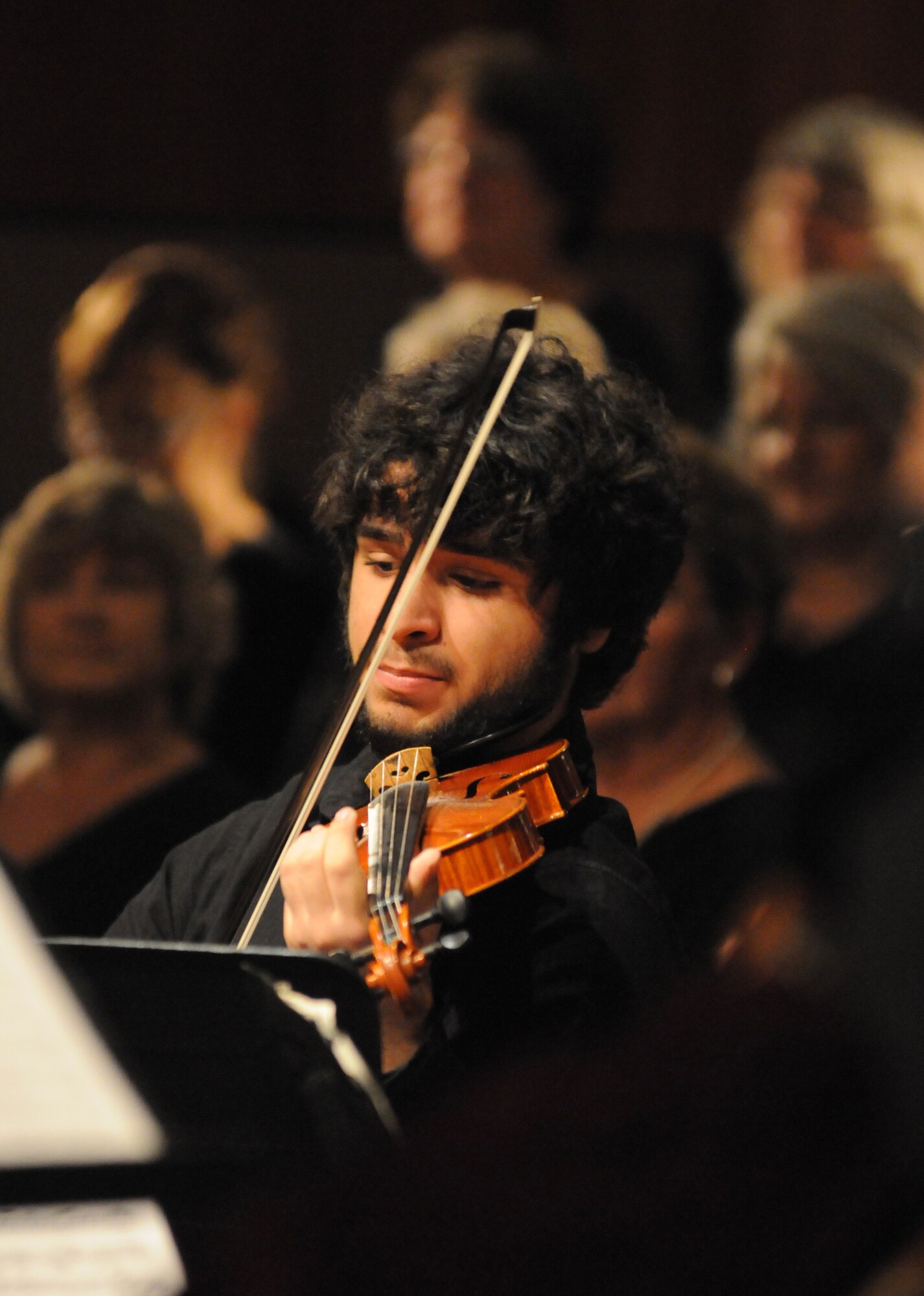 A member of the Gulf Coast Messiah Chorus plays the violin during their 61st Annual celebration Dec. 5, 2013, at the Triangle Chapel, Keesler Air Force Base, Miss. The Choir’s first performance, under the direction of conductor Dr. Paul McGahie, began at Keesler and is made up by musicians from both the military and civilian communities. (U.S. Air Force photo by Kemberly Groue)