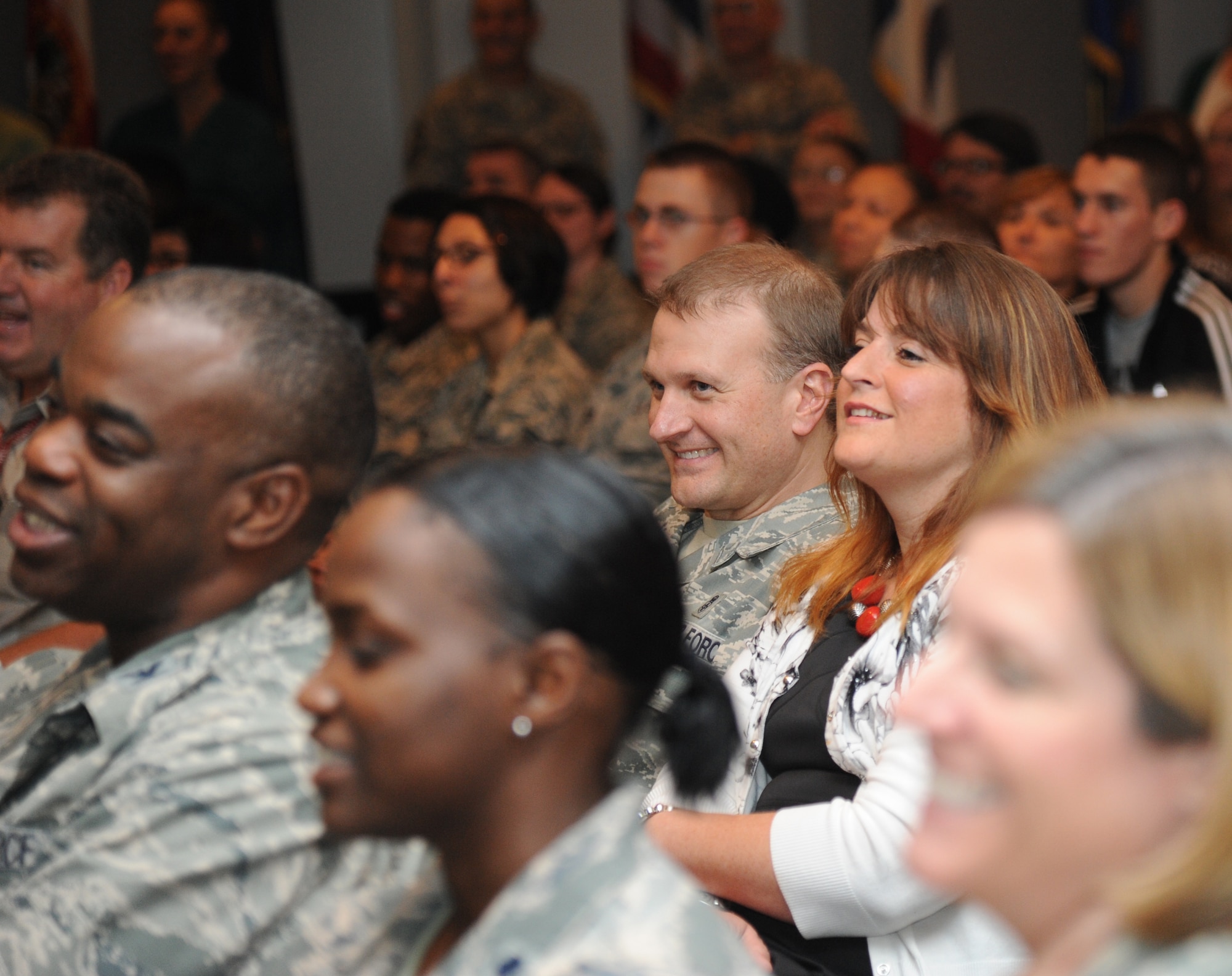 Chief Master Sgt. Michael Wood, 81st Medical Group superintendant, and his wife, Angela, Keesler housing and referral office, listen to retired Army Brig. Gen. Rhonda Cornum as she shares her experience as a prisoner of war during the Persian Gulf conflict with Keesler personnel Dec. 5, 2013, at the Keesler Medical Center.  During the Persian Gulf War, Cornum’s helicopter was shot down while on a search and rescue mission. She suffered two broken arms, a gunshot wound in the back and was captured by enemy forces. (U.S. Air Force photo by Kemberly Groue)