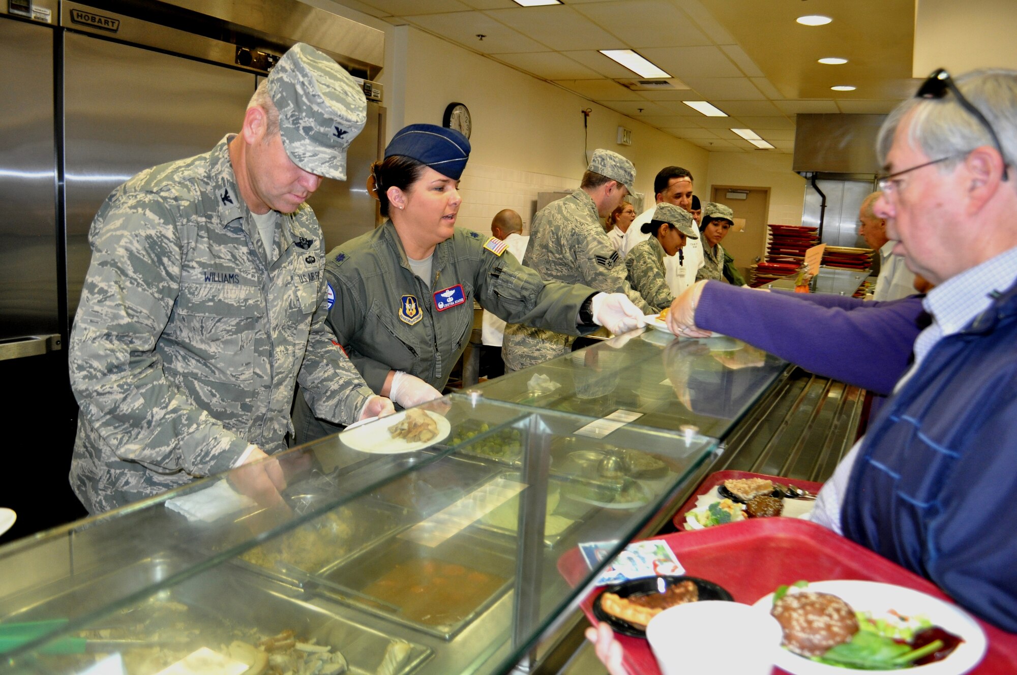 Volunteers from the 60th and 349th Air Mobility Wings serve up Thanksgiving dinner at the Yountville Veterans Home Nov. 28. From the left: Col. Patrick Williams, 349th AMW vice commander, Lt. Col. Christina Soares, 79th Air Refueling Squadron commander, Senior Amn. Steven Bunnell, 60th Logistics Readiness Squadron, Capt. Selamawit Gebreslassie, 349th Medical Squadron, and SrA Luz Fuller, 349th LRS. Home (U.S. Air Foce photo/Ellen Hatfield)