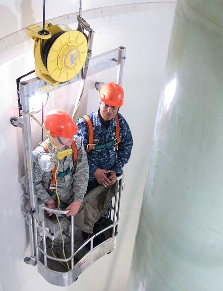 131203-F-JW079-289 Airman 1st Class Levi Janssen, 90th Maintenance Operations Squadron, takes Adm. Cecil D. Haney, commander, U.S. Strategic Command, for a ride in the maintenance cage in the 90th Missile Wing’s training launch facility Uniform-2, Dec. 3, 2013, at F.E. Warren Air Force Base. During his visit, Haney thanked the Airmen for their service and stressed the vital nature of their contributions to our nation’s nuclear deterrence mission. (U.S. Air Force Photo by R.J. Oriez)