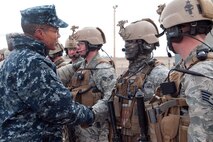 131203-F-JW079-168 Adm. Cecil Haney, commander, U.S. Strategic Command, shakes hands with members of the 90th Security Forces Group Tactical Response Force Dec. 3, 2013, after the TRF team performed a missile alert facility recapture demonstration.  Haney visited with Airmen from across the base during his visit, thanking them and stressing the importance of their contributions to our nation’s nuclear deterrence mission. (U.S. Air Force photo by Rich Oriez)