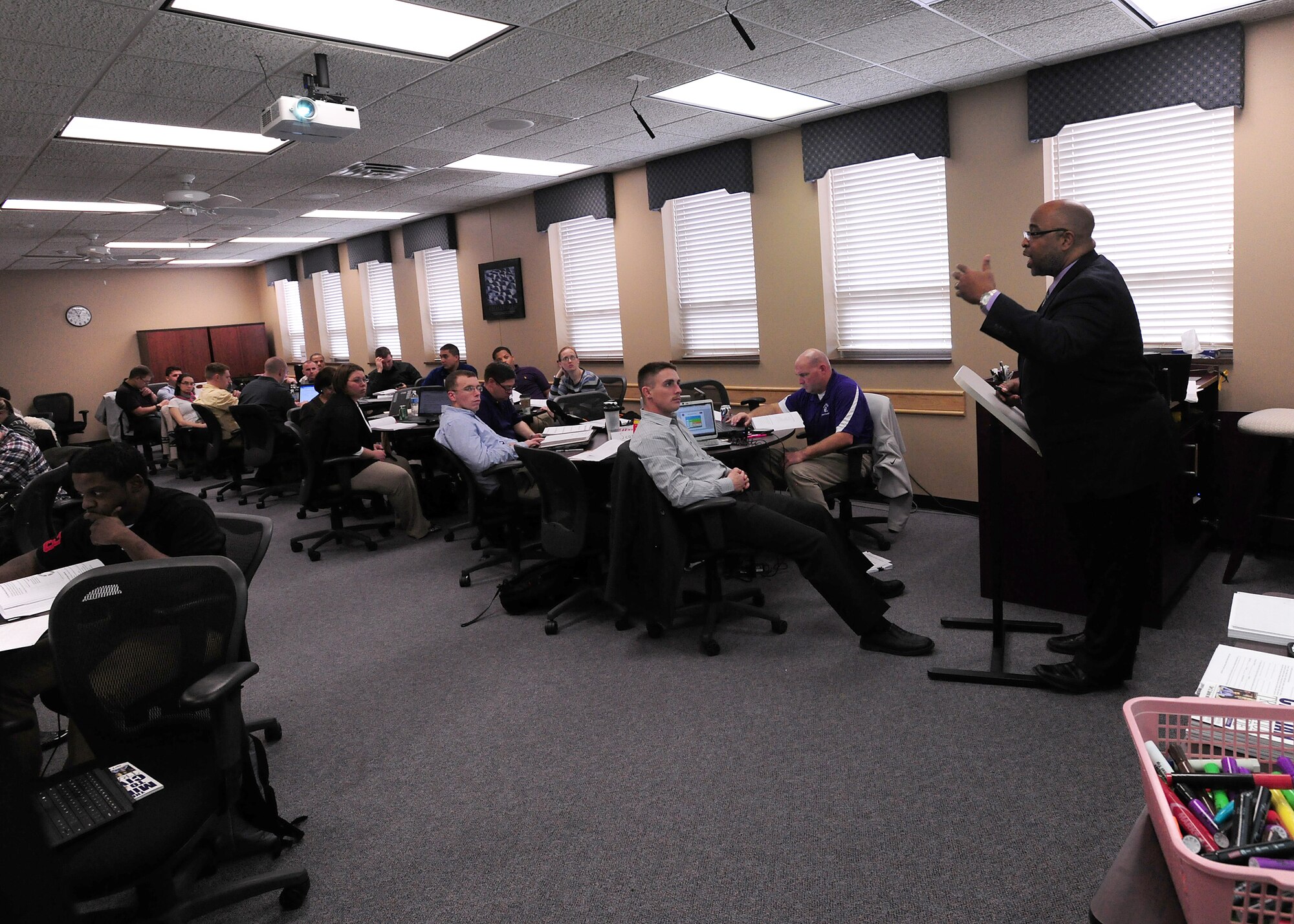 John Leonard Harris, a career transition trainer with Insignia Federal Group teaches job-interview techniques to a group of service members transitioning to civilian life as part of the Transition Assistance Program seminar at the Offutt Airman Family and Readiness Center, Nov. 22, 2013. (U.S. Air Force photo by Tech. Sgt. Markus M. Maier/Released)