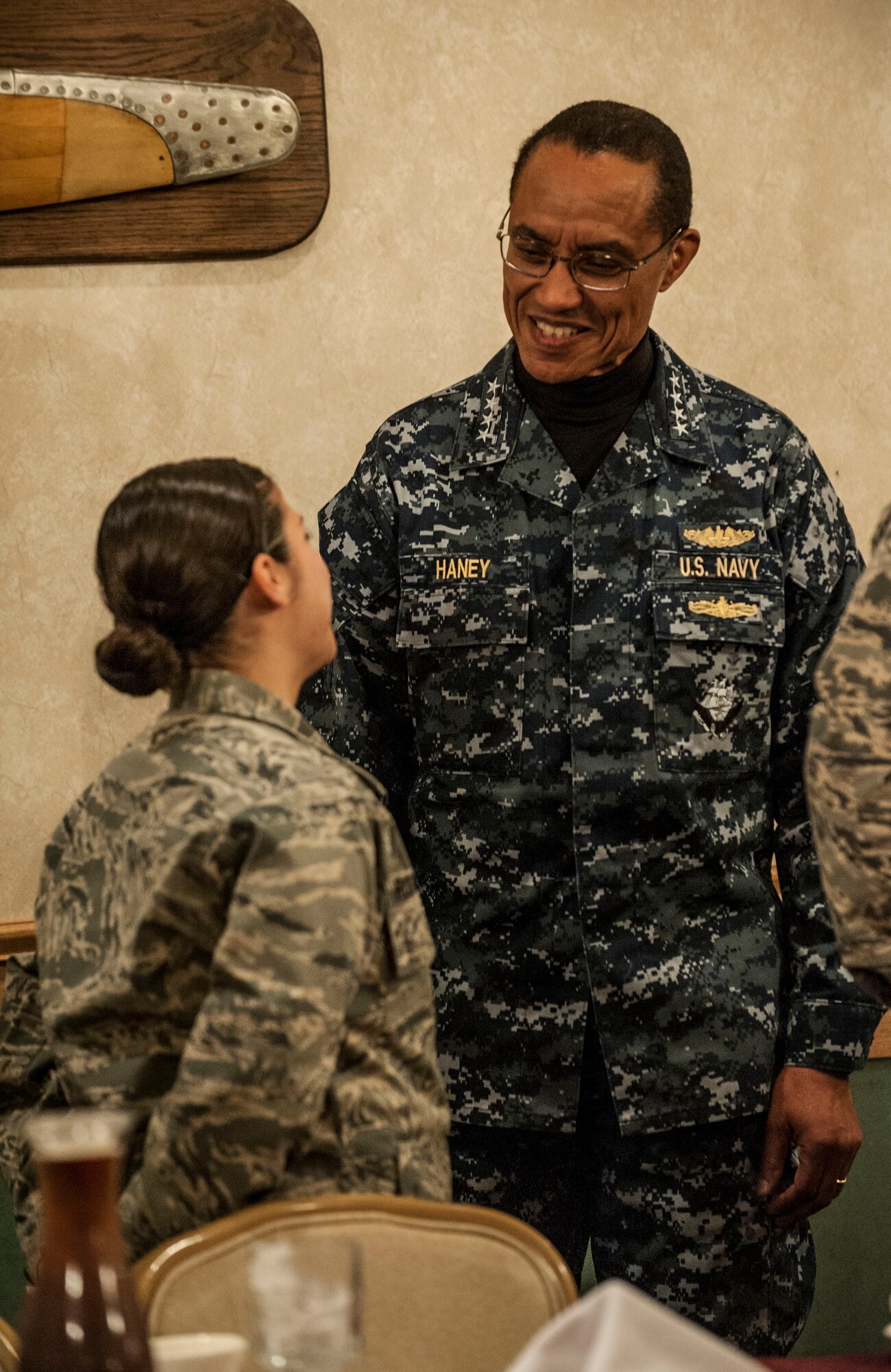 Admiral Cecil D. Haney, commander, US Strategic Command, talks with Airmen at a company grade officer's breakfast, held at the Jimmy Doolittle Center during a visit to Minot Air Force Base, Dec. 2. During the trip, he spoke to base personnel about their vital role at Minot in supporting two legs of the nuclear triad. (U.S. Air Force photo/Senior Airman Stephanie Sauberan)
