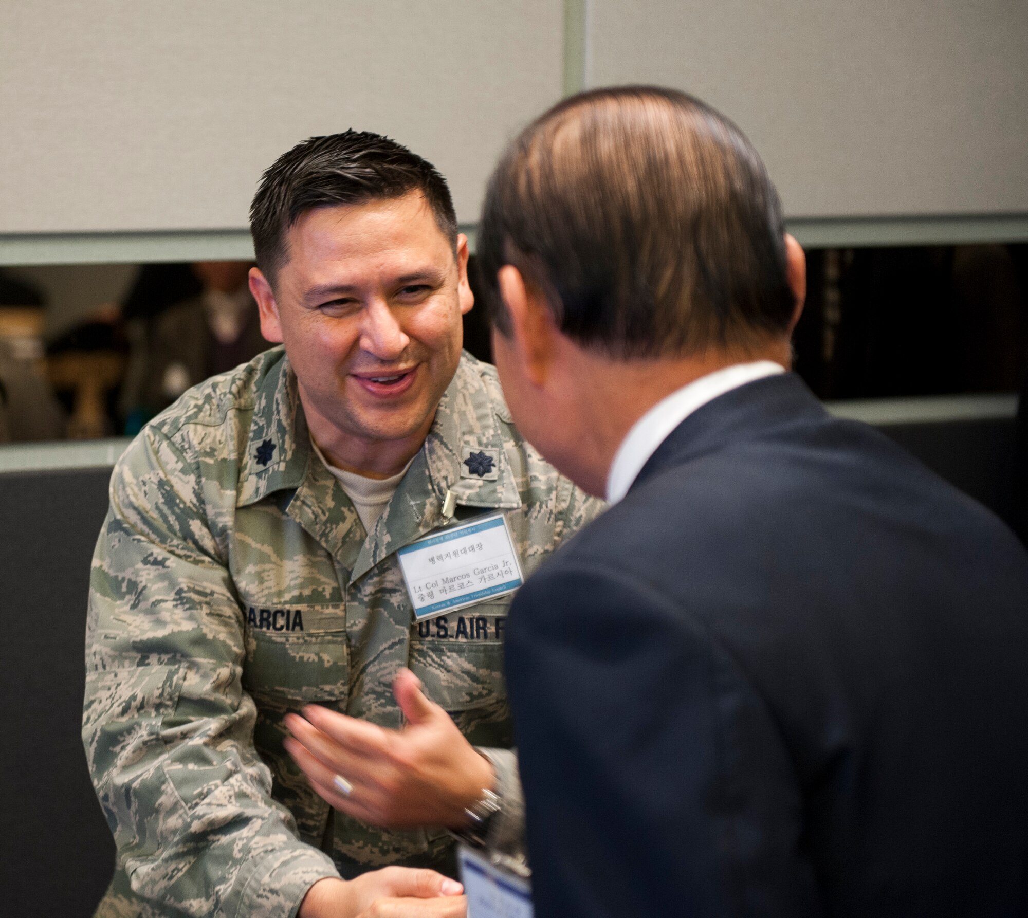 Lt. Col. Marcos Garcia, 8th Force Support Squadron, greets Moon Dong-shin, Gunsan City mayor, during an appreciation event in Gunsan City, Republic of Korea, Dec. 5, 2013. The Korean and American Gunsan Alliance group held an event in recognition of the cooperation and support between the Gunsan community and Kunsan Air Base. (U.S. Air Force photo by Senior Airman Armando A. Schwier-Morales/Released)