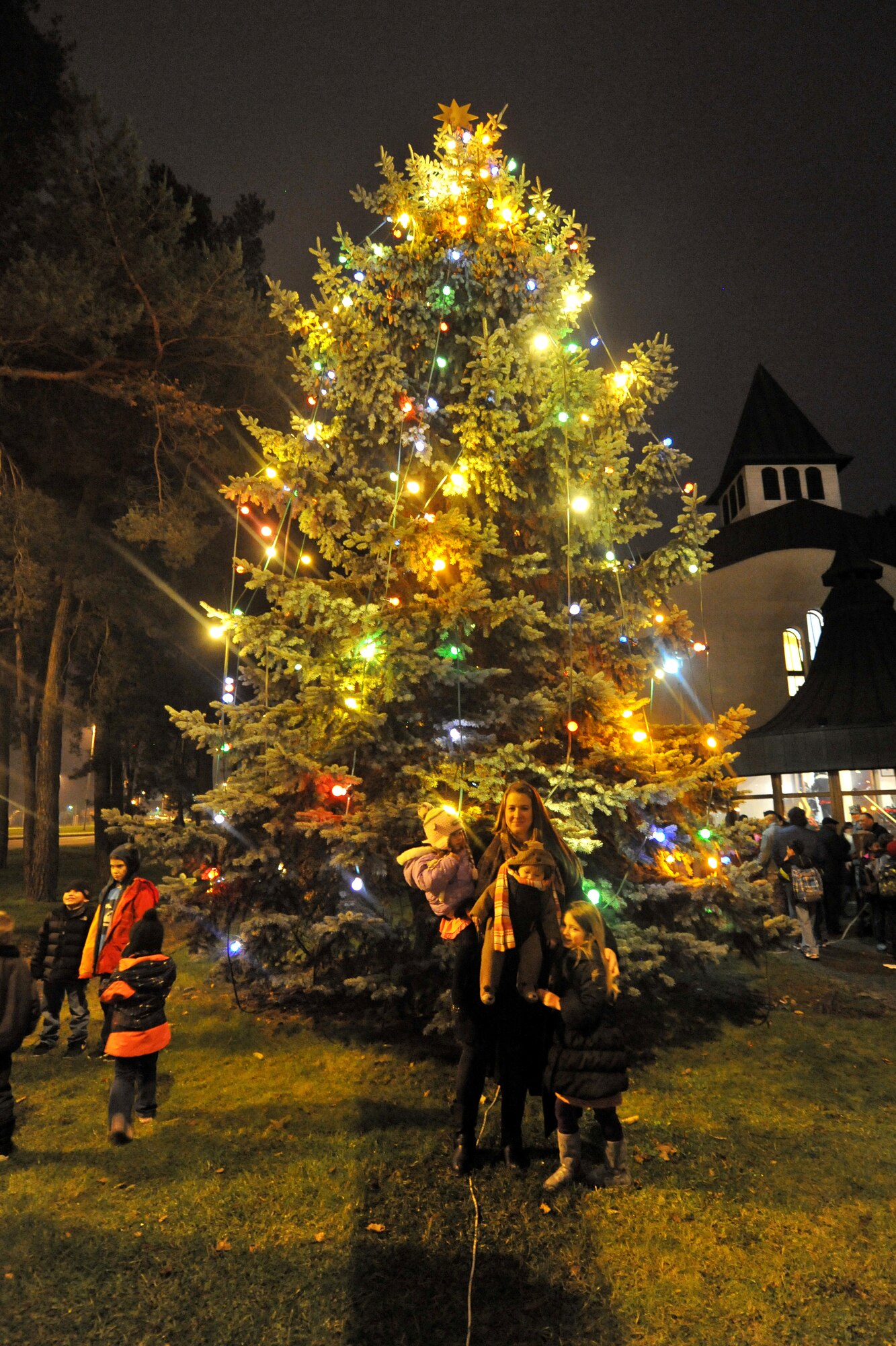 Kaiserslautern Military Community members participated in the lighting of the Christmas tree on Kapuan Air Station, Germany, Dec. 03, 2013. The ceremony included seasonal music, the tree lighting and holiday treats. (U.S. Air Force photo/Senior Airman Chris Willis)
