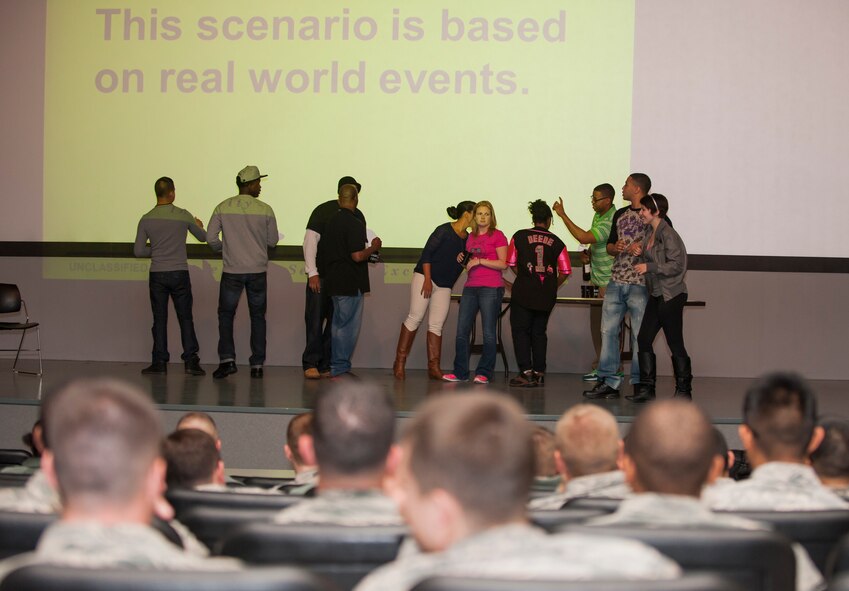 Actors from the Kunsan Sexual Assault Theater Group perform a sexual assault prevention and response scenario during an all call at Kunsan Air Base, Republic of Korea, Dec. 6, 2013. The wing commander held all calls featuring a SAT-G performance, SAPR training and a question and answer session, as part of a continuing effort to combat sexual assault and promote a culture change. (U.S. Air Force photo by Senior Airman Armando A. Schwier-Morales/Released)