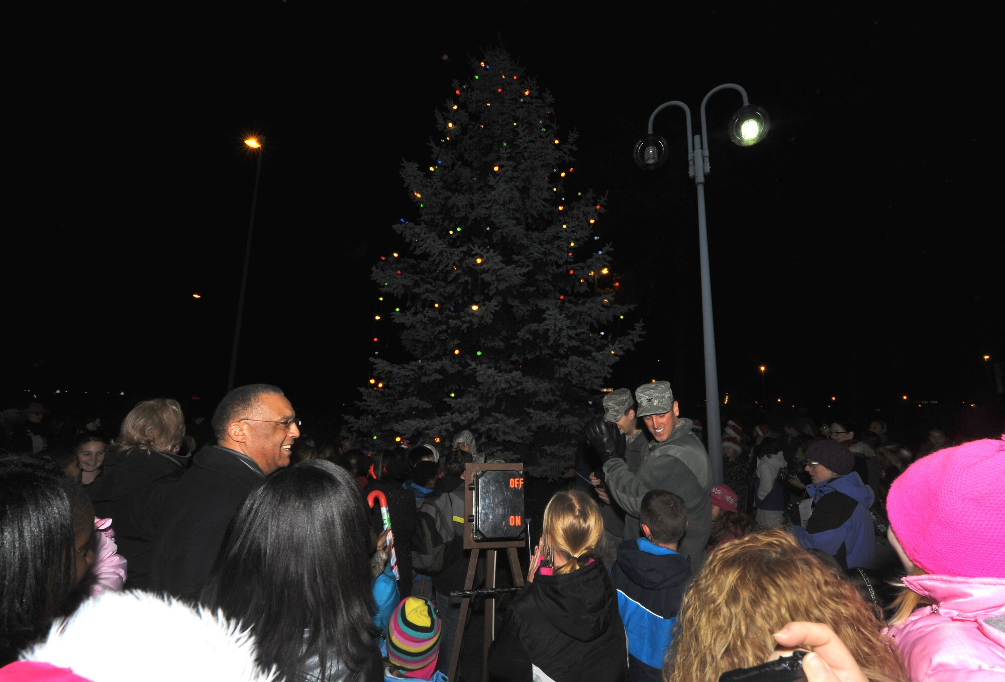 Kaiserslautern Military Community members participated in the lighting of the Christmas tree on Kapuan Air Station, Germany, Dec. 03, 2013. The ceremony included seasonal music, the tree lighting and holiday treats. (U.S. Air Force photo/Senior Airman Chris Willis)