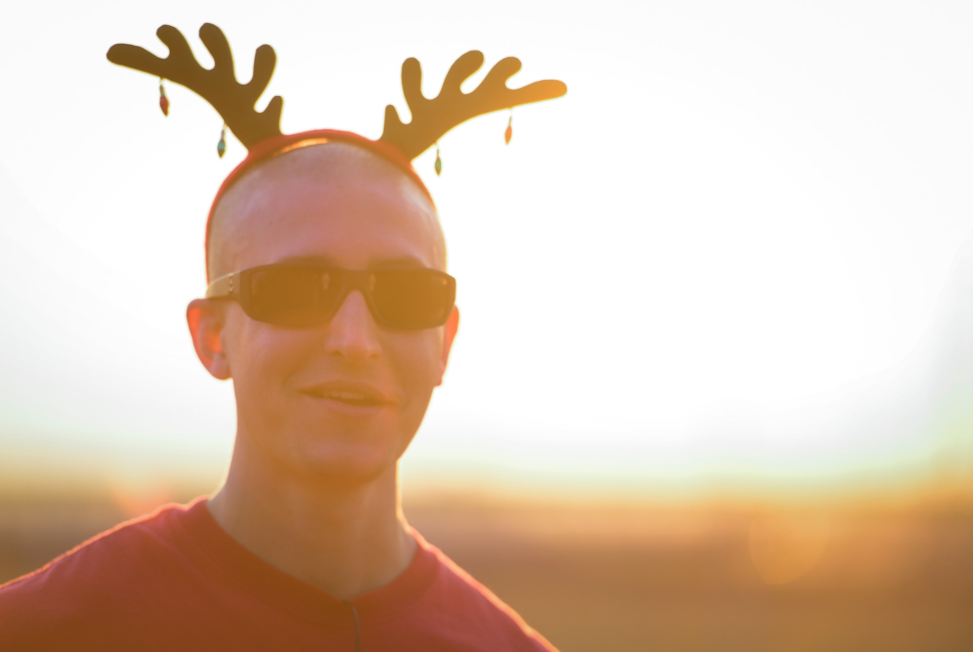 A runner displays his holiday spirit by wearing antlers during an Ugly Sweater 5k run at Yokota Air Base, Japan, Dec. 5, 2013. Although ugly sweater were the theme, participants also wore Christmas-themed hats and other accessories. (U.S. Air Force photo by Senior Airman Cody H. Ramirez)