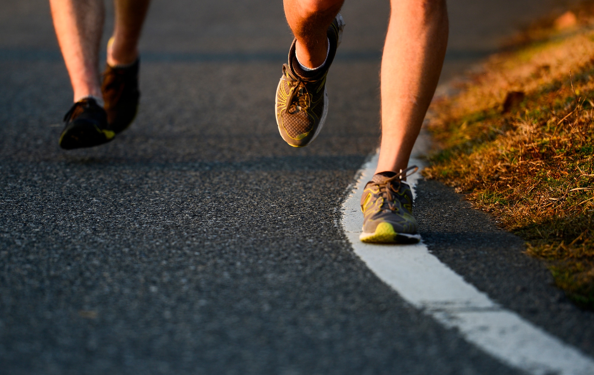 Runner’s feet hit the ground during an Ugly Sweater 5k run at Yokota Air Base, Japan, Dec. 5, 2013. The 374th Force Support Squadron conducts themed 5k runs throughout each year to promote morale and unity. (U.S. Air Force photo by Senior Airman Cody H. Ramirez)