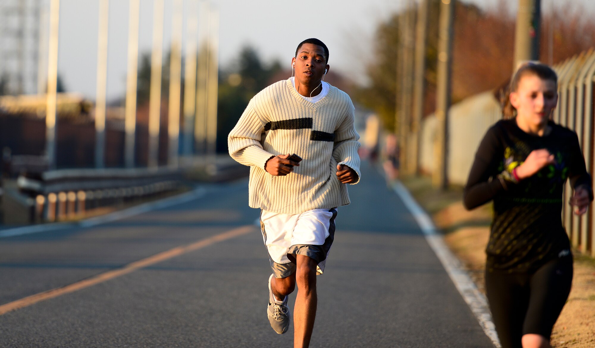 A runner nears the end of an Ugly Sweater 5k run at Yokota Air Base, Japan, Dec. 5, 2013. The run brought community members together to celebrate the holiday spirit. (U.S. Air Force photo by Senior Airman Cody H. Ramirez)