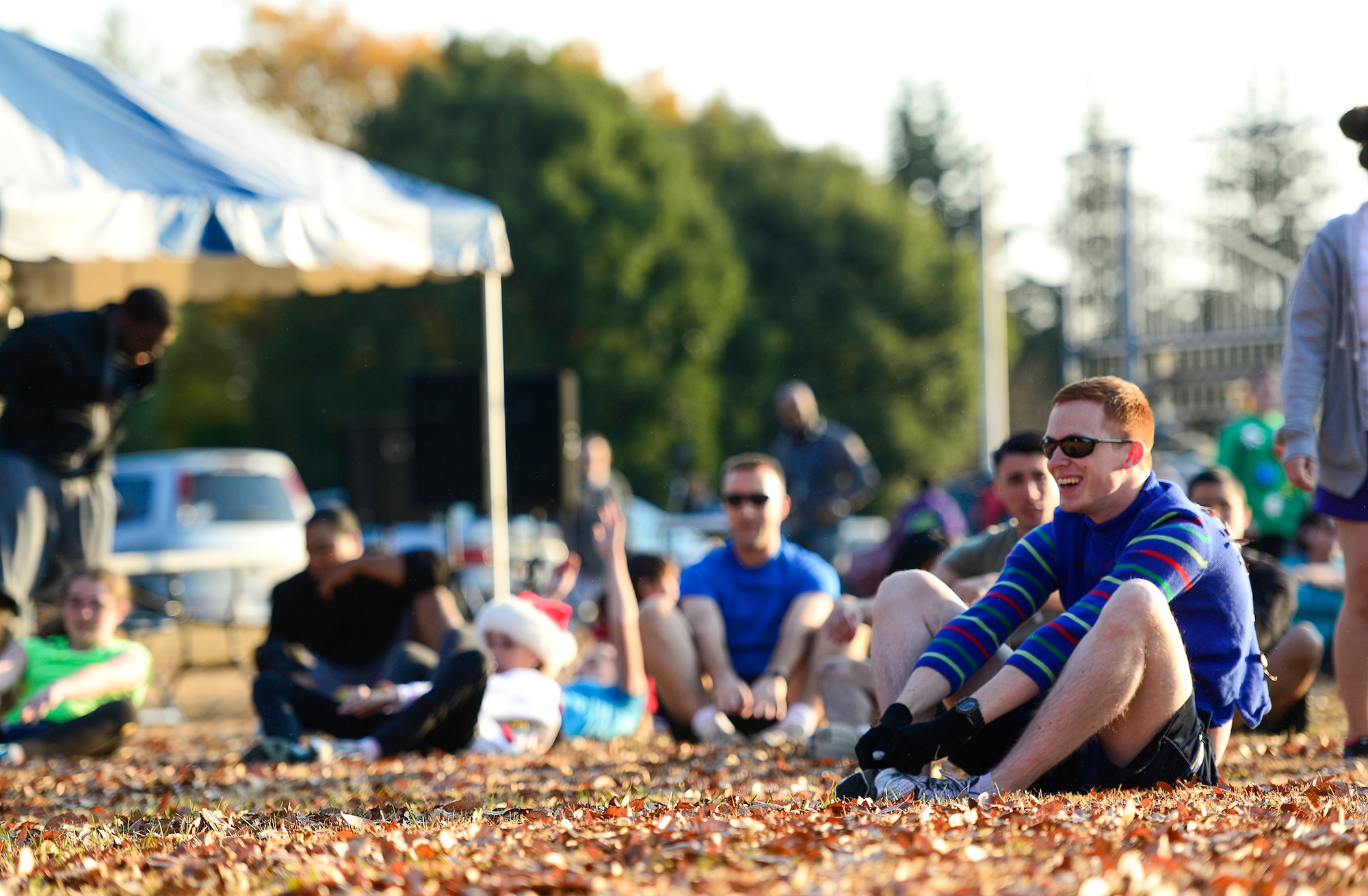 Community members stretch before an Ugly Sweater 5k run at Yokota Air Base, Japan, Dec. 5, 2013. More than 80 people showed up to the event hosted by the 374th Force Support Squadron. (U.S. Air Force photo by Senior Airman Cody H. Ramirez)