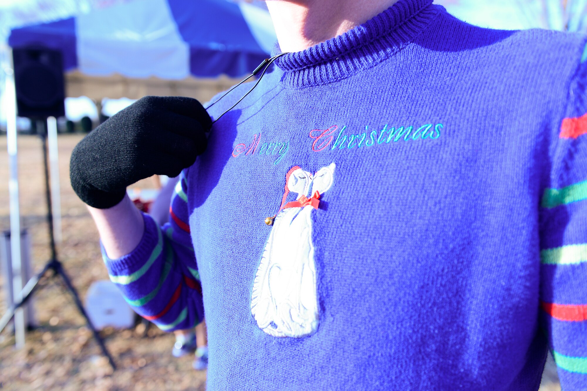 Senior Airman Witten Bolte, 374th Aircraft Maintenance Squadron crew chief, wears a Christmas sweater at an Ugly Sweater 5k run at Yokota Air Base, Japan, Dec. 5, 2013. The run was organized by the 374th Force Support Squadron and included raffle prizes. (U.S. Air Force photo by Senior Airman Cody H. Ramirez)