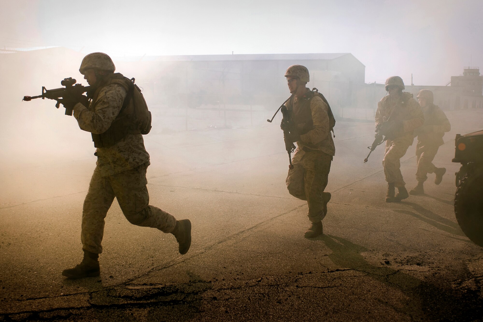 U.S. Marines from Detachment One, Communication Company, Combat Logistics Regiment 45, 4th Marine Logistics Group, secure a building at a simulated overseas location during a joint, mass-casualty exercise held at Grissom Air Reserve Base, Ind., Aug 4, 2013. The Marines teamed up with Air Force security forces, explosives ordnance disposal and medics from the 434th Air Refueling Wing during the exercise. (U.S. Air Force photo/Tech. Sgt. Mark R. W. Orders-Woempner)