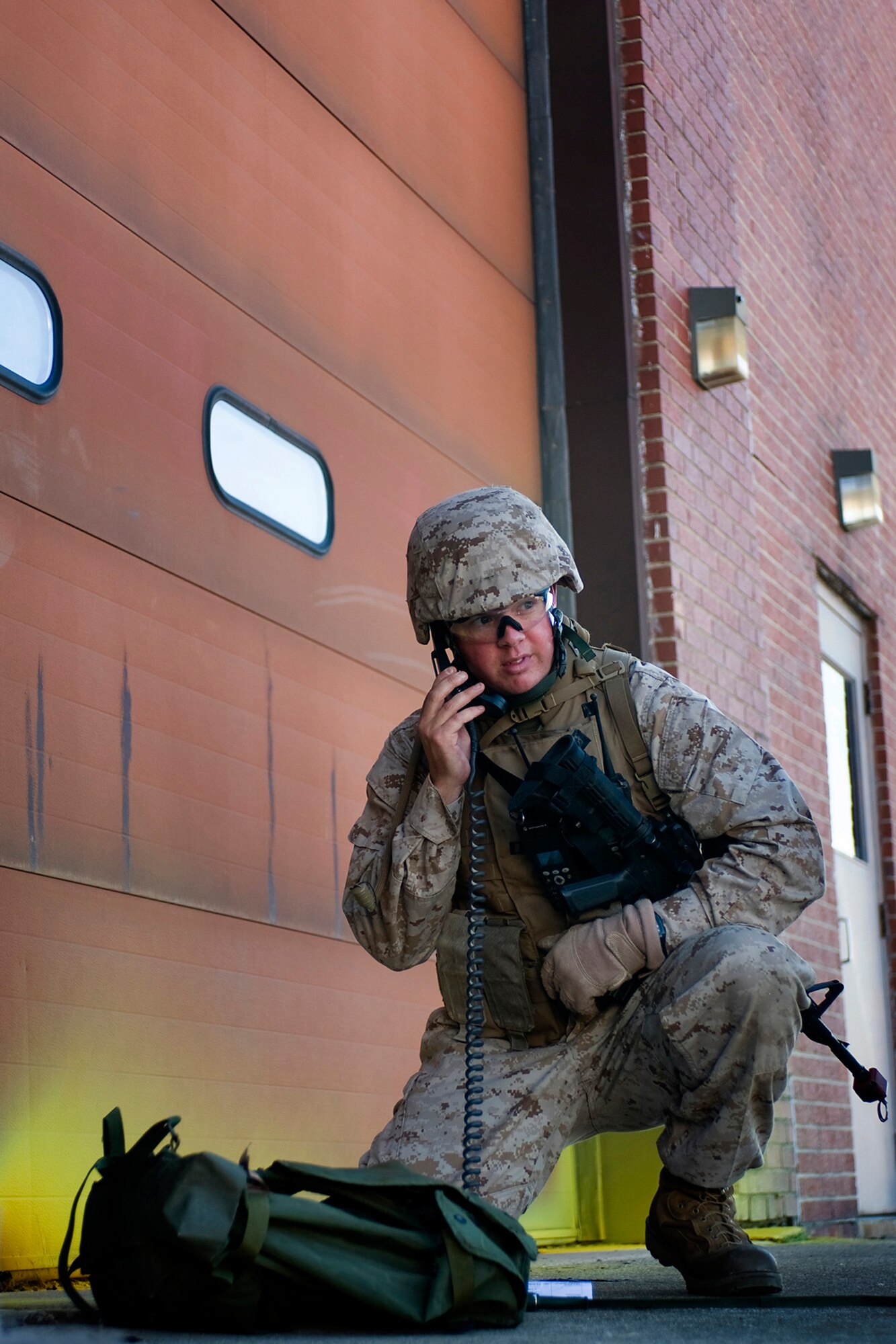 U.S. Marine Capt. Scott Monroe, 4th Marine Logistics Group Forward East, communicates with fellow Marines via radio during a joint, mass-casualty exercise held at Grissom Air Reserve Base, Ind., Aug. 4, 2013. During the exercise Monroe led a joint U.S. force that was tasked with providing security to a democratic voting process in a foreign nation. (U.S. Air Force photo/Tech. Sgt. Mark R. W. Orders-Woempner) 

