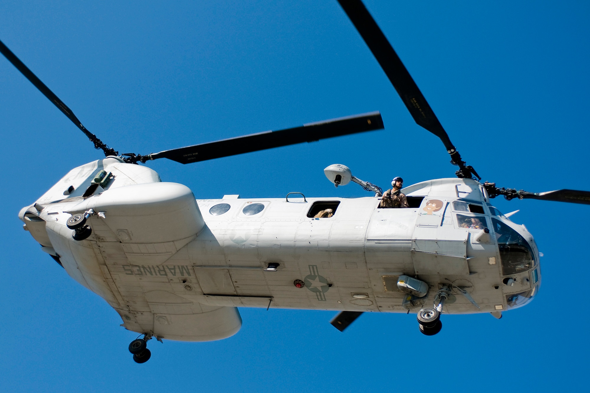 A U.S. Marine CH-46 Sea Knight helicopter flies over Grissom Air Reserve Base, Ind., during a joint, mass-casualty exercise held at the north central Indiana base Aug. 4, 2013. The CH-46 and its crew were assigned to the Marine Medium Helicopter Squadron 774 at Naval Station Norfolk, Va., and participated in air assault and casualty evacuation scenarios during the exercise. (U.S. Air Force photo/Tech. Sgt. Mark R. W. Orders-Woempner