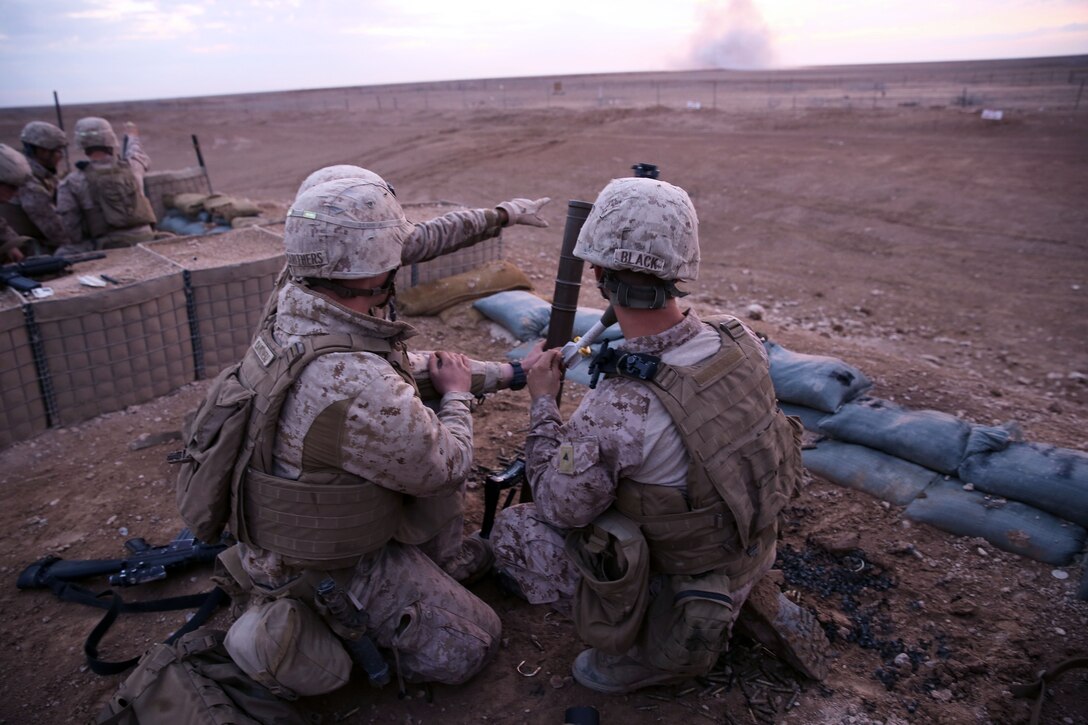 U.S. Marines observe the impact of a 60mm mortar round during unknown distance, live-fire training on Camp Leatherneck in Helmand province, Afghanistan, Nov. 24, 2013. The Marines are assigned to India Company, 3rd Battalion, 7th Marine Regiment.