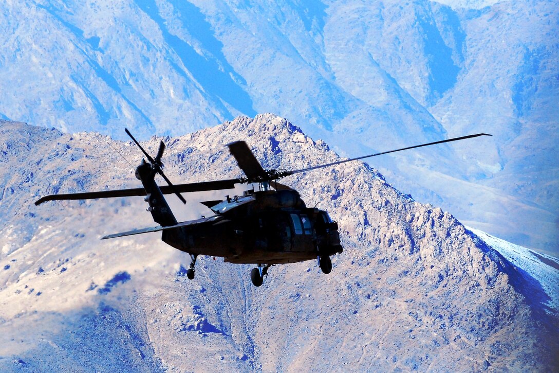 A U.S. Army UH-60M Black Hawk helicopter flies a personnel movement mission over Logar province, Afghanistan, Dec. 4, 2013. The helicopter crew is assigned to Company C, 2nd Battalion Assault, 10th Combat Aviation Brigade.