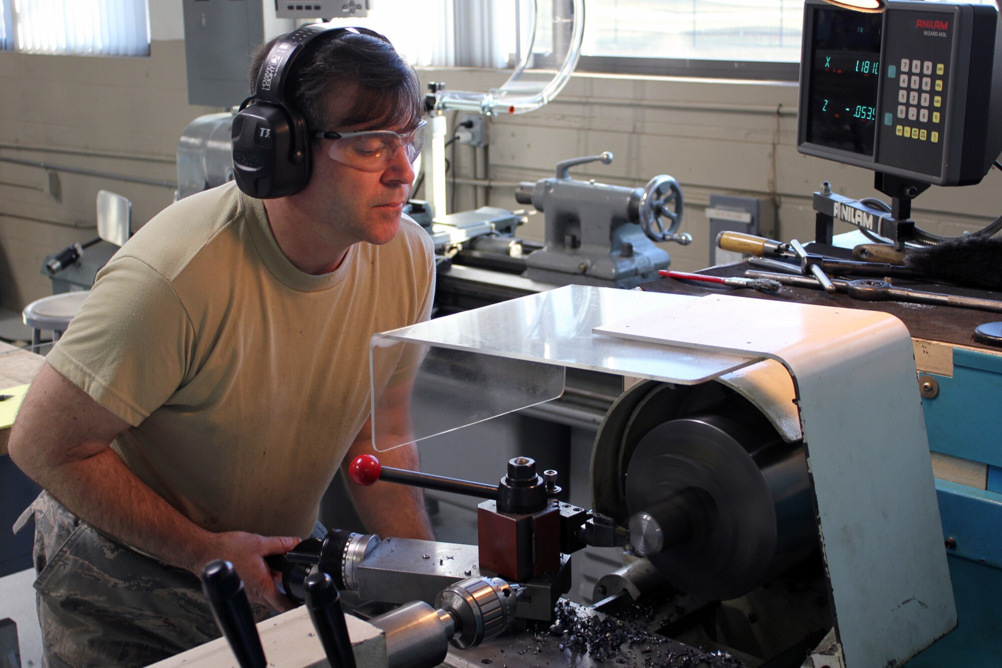 131207-Z-VA676-030 – TSgt. Mark Cone uses a lathe to machine to fabricate an aircraft component at Selfridge Air National Guard Base, Mich., Dec. 7, 2013. Cone is a member of the 191st Maintenance Squadron at Selfridge, which supports the operation of the KC-135 Stratotanker. (U.S. Air National Guard photo by TSgt. Dan Heaton / Released)