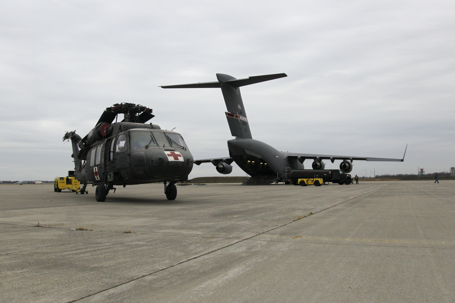 C-17 unloads UH-60 helicopters