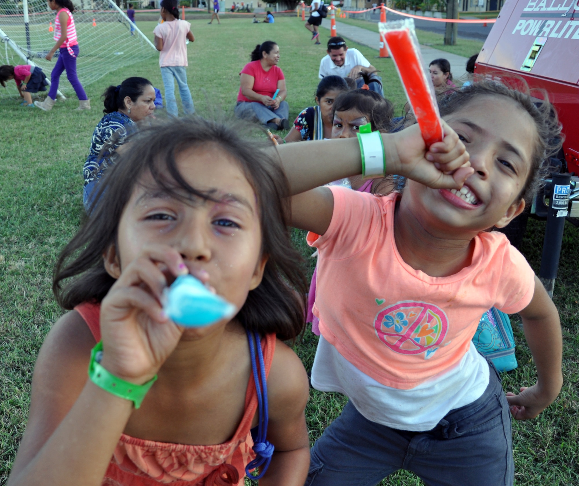 Honduran orphans enjoy a frozen treat during Joint Task Force-Bravo's "Operation Holiday Blessing," at Soto Cano Air Base, Honduras, Dec. 6, 2013.  More than 300 Honduran orphans were treated to a day of activities, gifts, and holiday joy, provided by more than 200 volunteers from the Task Force.  (U.S. Air Force photo by Capt. Zach Anderson)