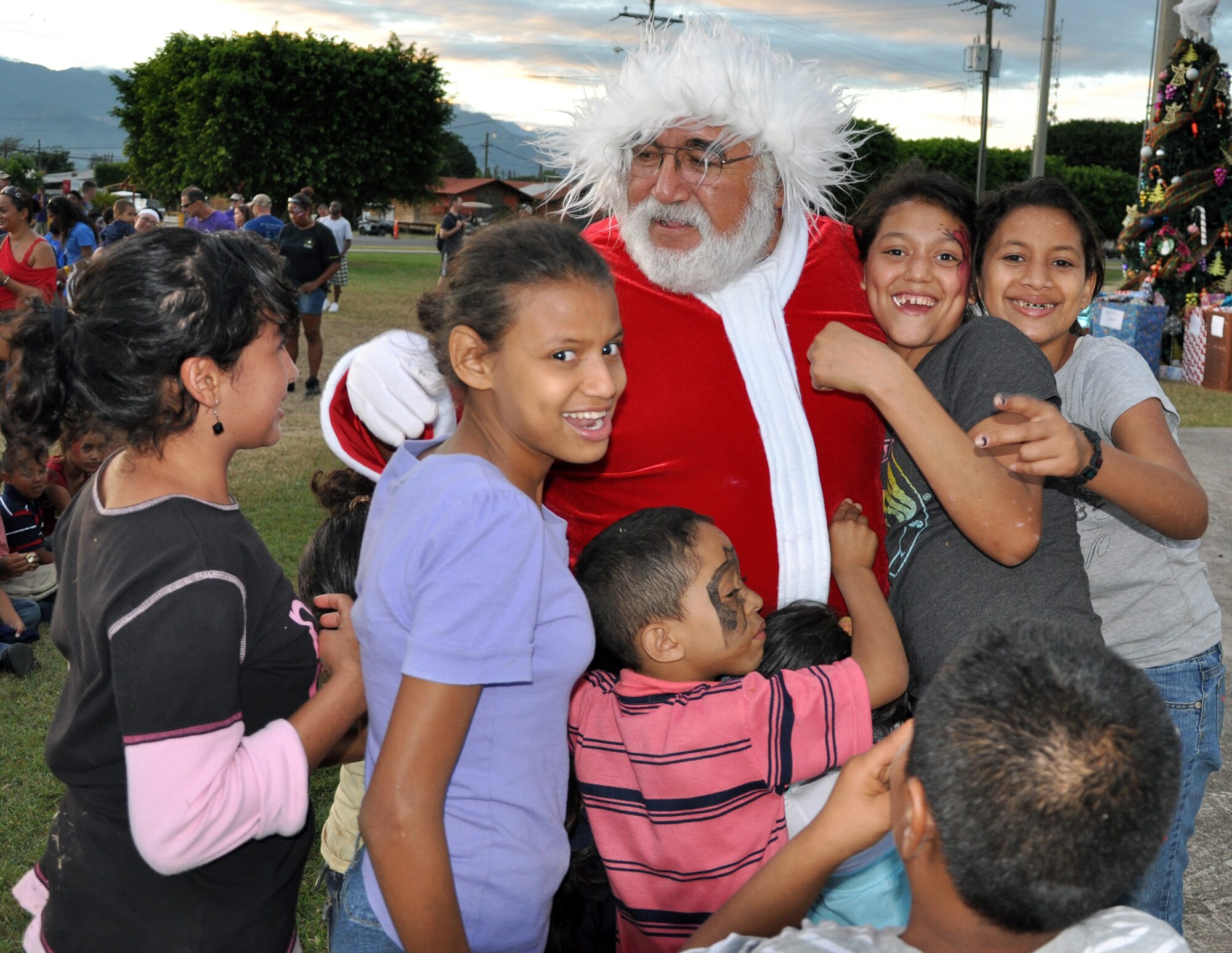 Honduran orphans greet Santa Claus during Joint Task Force-Bravo's "Operation Holiday Blessing," at Soto Cano Air Base, Honduras, Dec. 6, 2013.  More than 300 Honduran orphans were treated to a day of activities, gifts, and holiday joy, provided by more than 200 volunteers from the Task Force.  (U.S. Air Force photo by Capt. Zach Anderson)