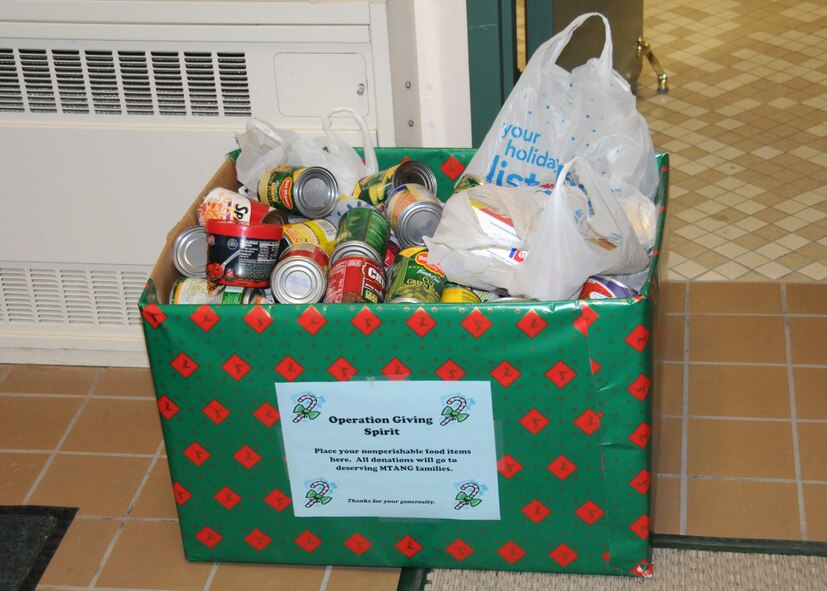 An “Operation Giving Spirit” box sits full of canned goods at the entrance of the Dining Facility on Dec. 18, 2009. Similar boxes will be distributed around the 120th Fighter Wing to collect food for this year’s event. National Guard photo/Senior Master Sgt. Eric Peterson.