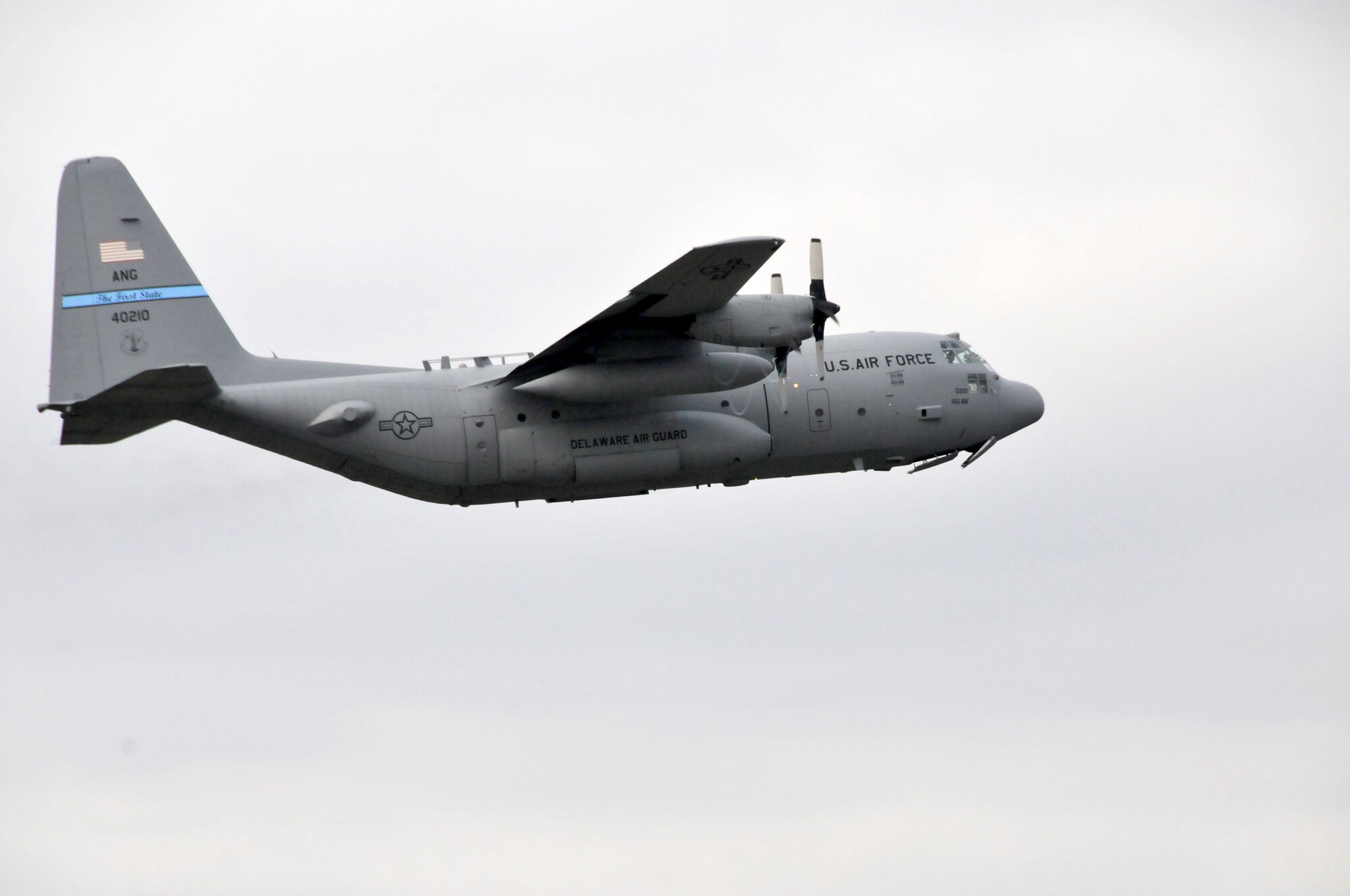 Delaware Air National Guard C-130 tail #40210 takes off from the New Castle ANG Base, Del., to perform a Joint Precision Airdrop System training mission with 13 aircrew members aboard on Dec. 7, 2013. This mission, along with another flight today, is recognized by the Delaware ANG to help celebrate the 166th Airlift Wing’s reaching the milestone of 175,000 safe flying hours without a serious mishap over the last 50 years. (U.S. Air National Guard photo by Tech. Sgt. Benjamin Matwey)