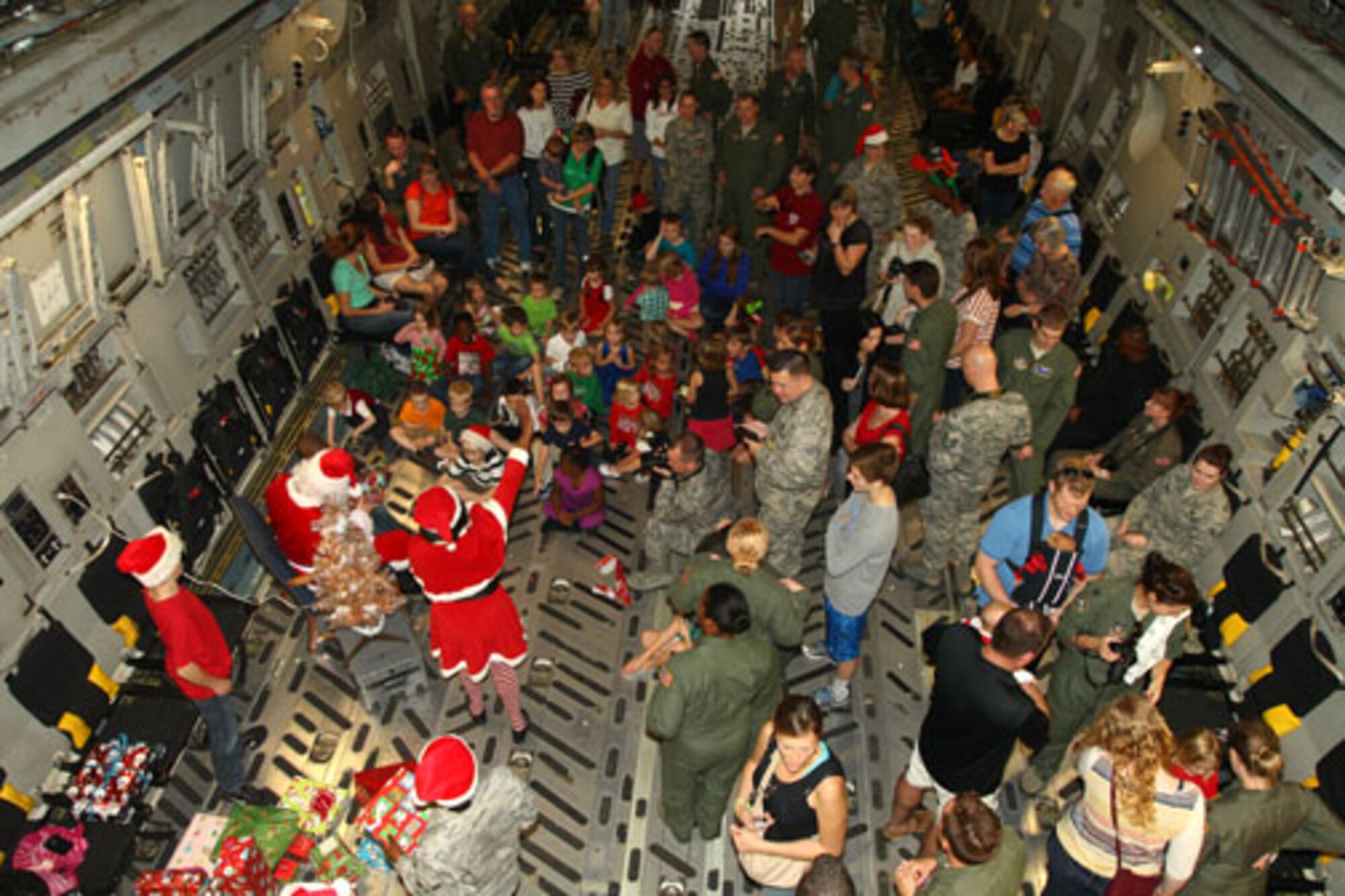 Santa visits the 315th Airlift Wing, Joint Base Charleston - Air Base, S.C. Saturday, Dec. 7 during the annual Santa flight.  The event provides an opportunity for airmen and thier families to share valuable time together during the holiday season. (U.S. Air Force photo by Staff Sgt. Rashard Coaxum/released)