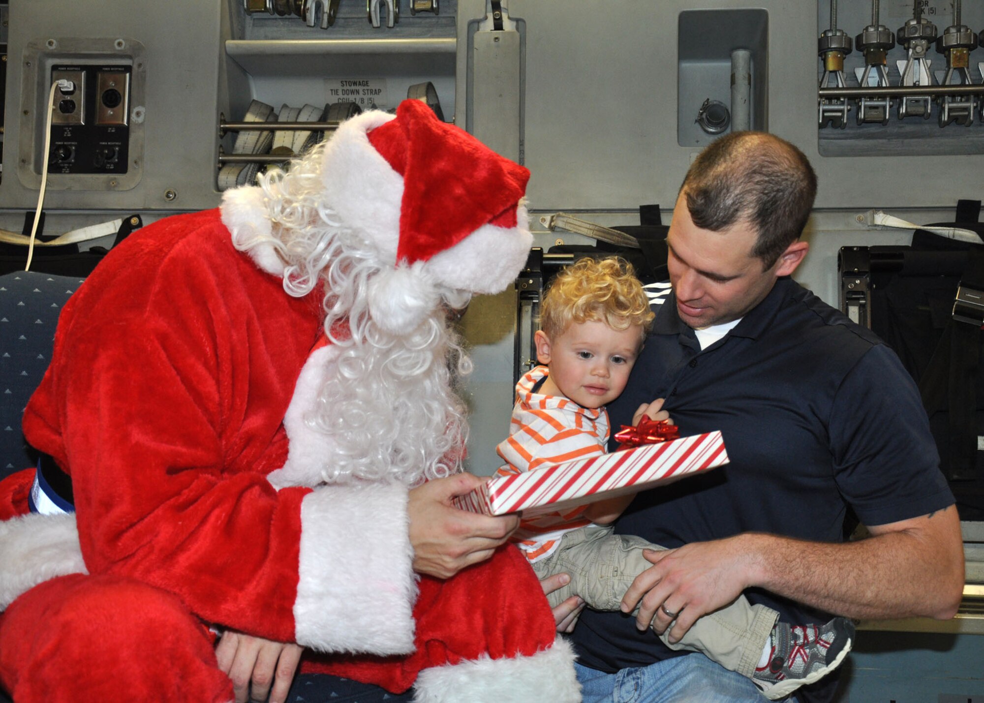 Santa visits the 315th Airlift Wing, Joint Base Charleston - Air Base, S.C. Saturday, Dec. 7 during the annual Santa flight.  The event provides an opportunity for airmen and thier families to share valuable time together during the holiday season. (U.S. Air Force photo by Senior Airman Bobby Pilch/released)