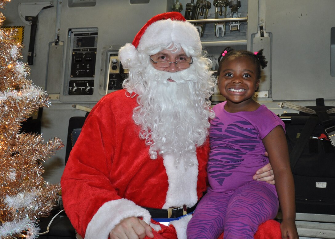 Santa visits the 315th Airlift Wing, Joint Base Charleston - Air Base, S.C. Saturday, Dec. 7 during the annual Santa flight.  The event provides an opportunity for airmen and thier families to share valuable time together during the holiday season. (U.S. Air Force photo by Senior Airman Bobby Pilch/released)