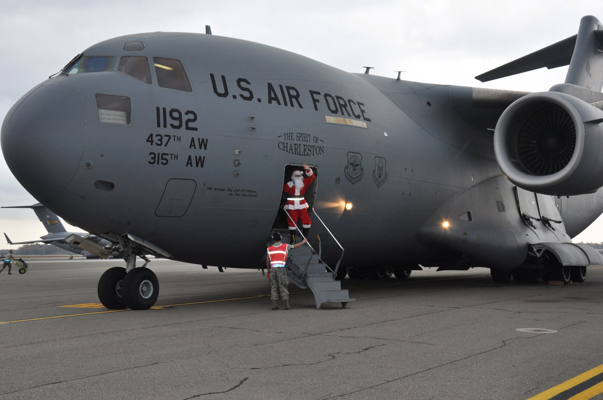 Santa visits the 315th Airlift Wing, Joint Base Charleston - Air Base, S.C. Saturday, Dec. 7 during the annual Santa flight.  The event provides an opportunity for airmen and thier families to share valuable time together during the holiday season. (U.S. Air Force photo by Senior Airman Bobby Pilch/released)