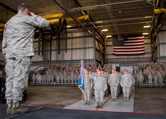 Col. James M. Phillips salutes his wing as the new commander of the 919th Special Operations Wing Dec 7, at Duke Field, Fla.  Phillips served as the 919th Special Operations Group commander before taking command of the wing. (U.S. Air Force photo/Tech. Sgt. Jasmin Taylor)