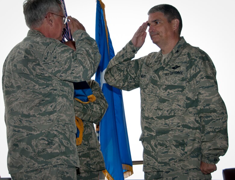Col. James M. Phillips salutes Maj. Gen. George F. Williams, Air Force Special Operations Command mobilization assistant to the commander, during an assumption of command ceremony that installed him as commander of the 919th Special Operations Wing Dec.  7, at Duke Field, Fla.   (U.S. Air Force photo/Tech. Sgt. Jasmin Taylor)