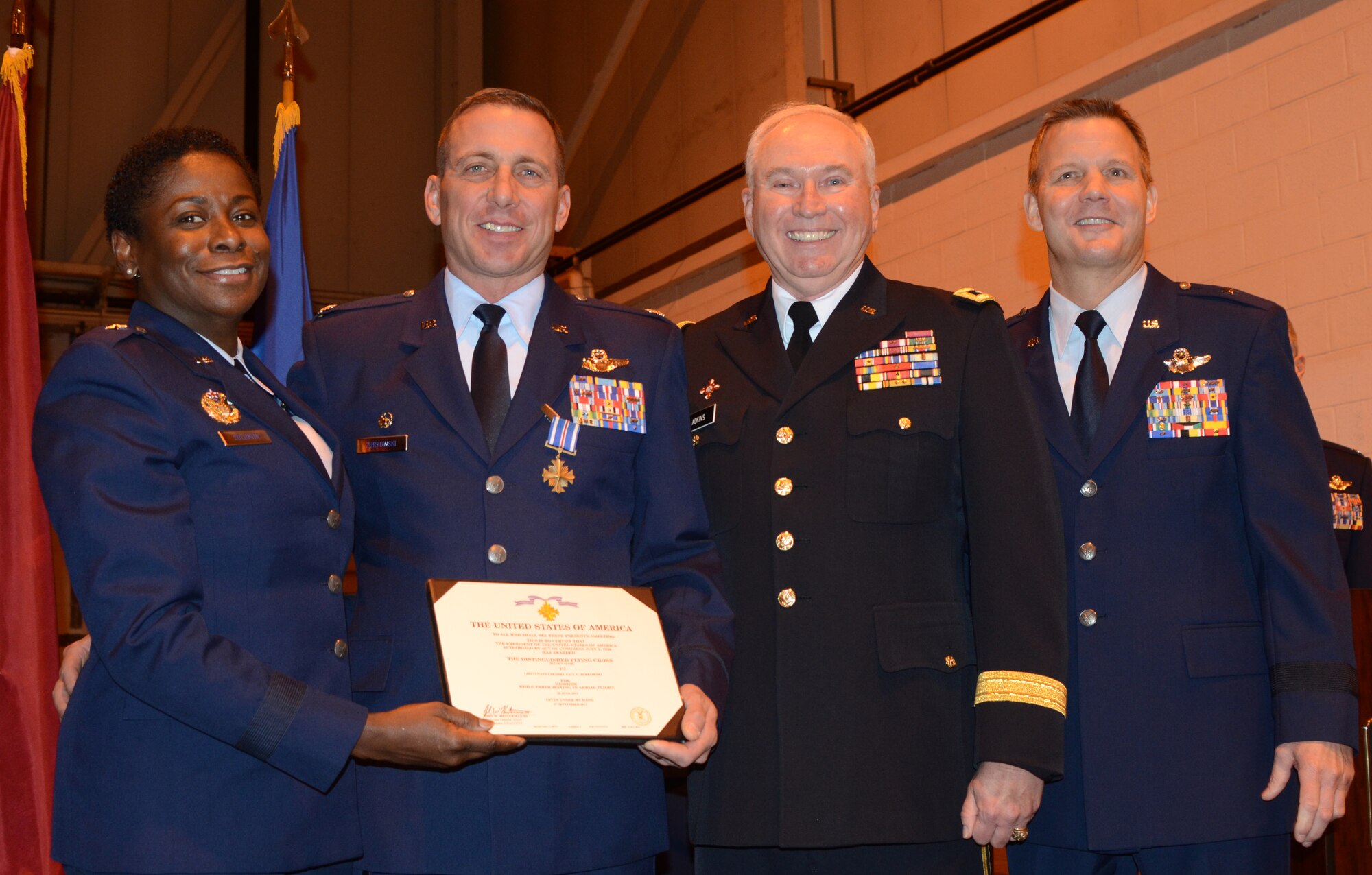 Lt. Col. Paul C. Zurkowski, 104th Fighter Squadron commander, is awarded the Distinguised Flying Cross for duty performed while deployed to Southwest Asia.  The award was given during a ceremony at Warfield Air National Guard base on December 8, 2013.  (Air National Guard photo by TSgt. David Speicher/RELEASED)