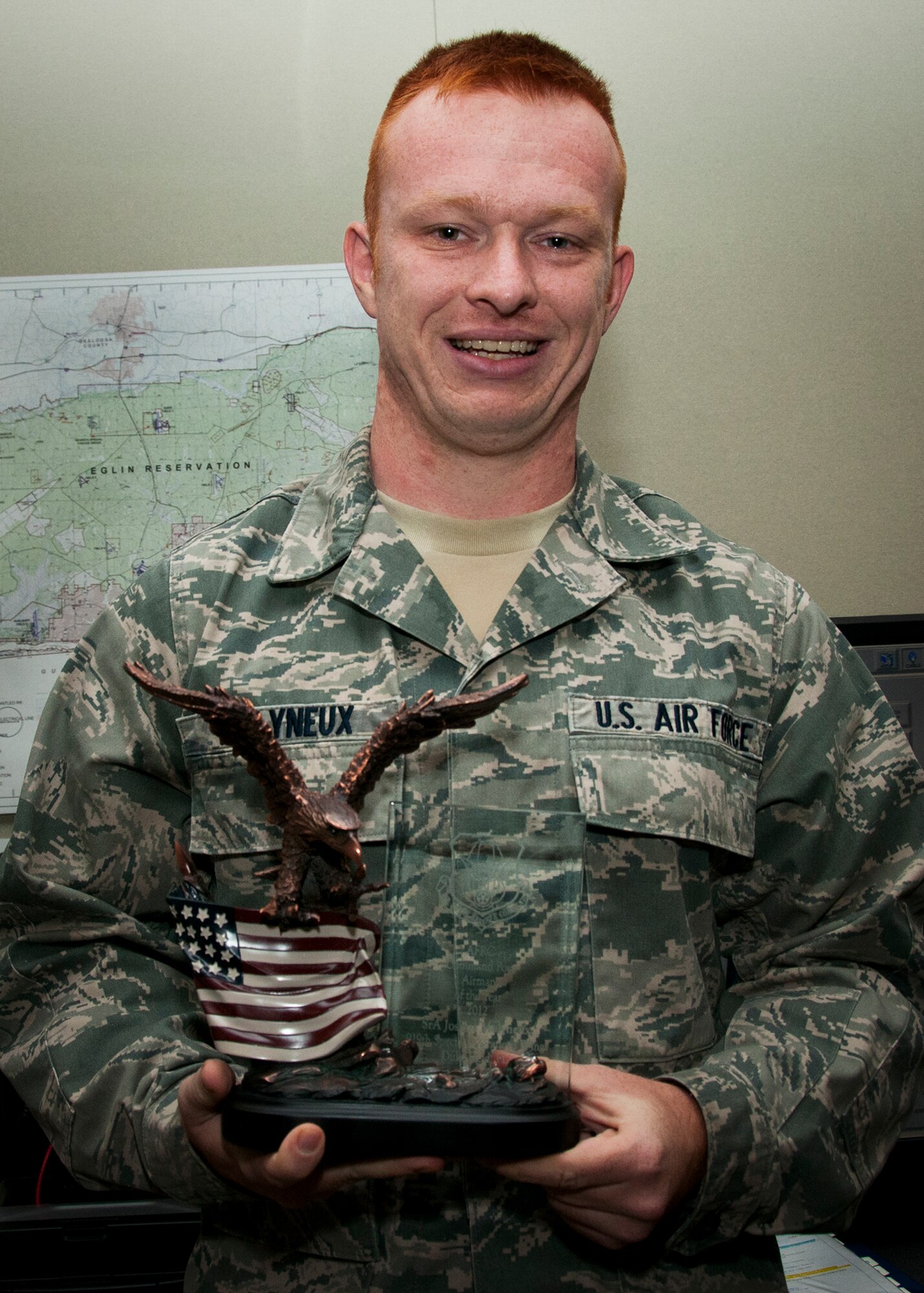 Congratulations to Senior Airman Josh Molyneux, of the 919th Special Operations Wing, on his selection as the Air Force Reserve Command Command Post Airman of the Year for 2012.  He was presented the trophy by Col. James Phillips, the 919th wing commander, Dec. 8.  (U.S. Air Force photo/Jasmin Taylor)